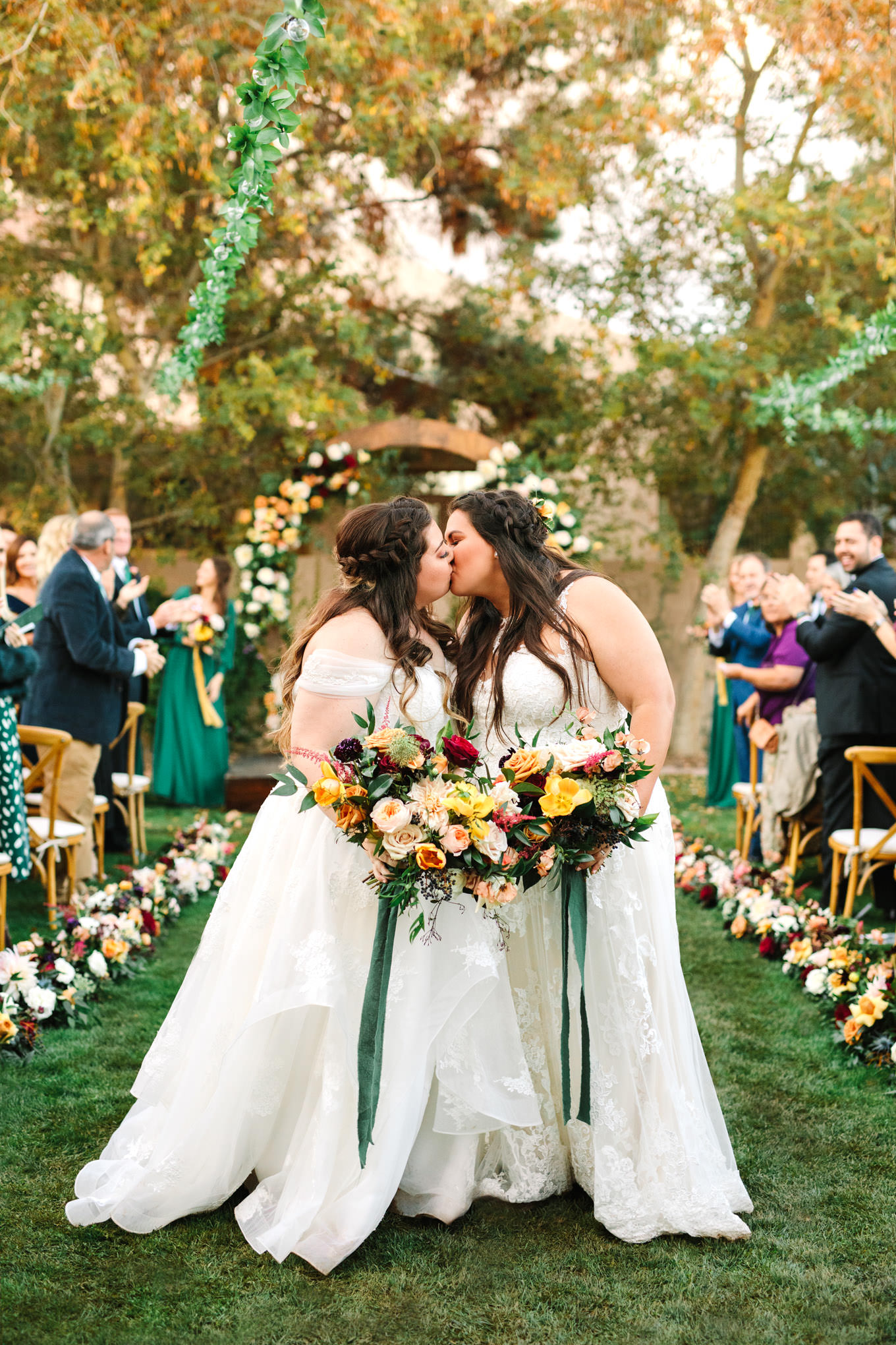 Brides kissing at the end of the aisle in backyard wedding | Engagement, elopement, and wedding photography roundup of Mary Costa’s favorite images from 2020 | Colorful and elevated photography for fun-loving couples in Southern California | #2020wedding #elopement #weddingphoto #weddingphotography   Source: Mary Costa Photography | Los Angeles