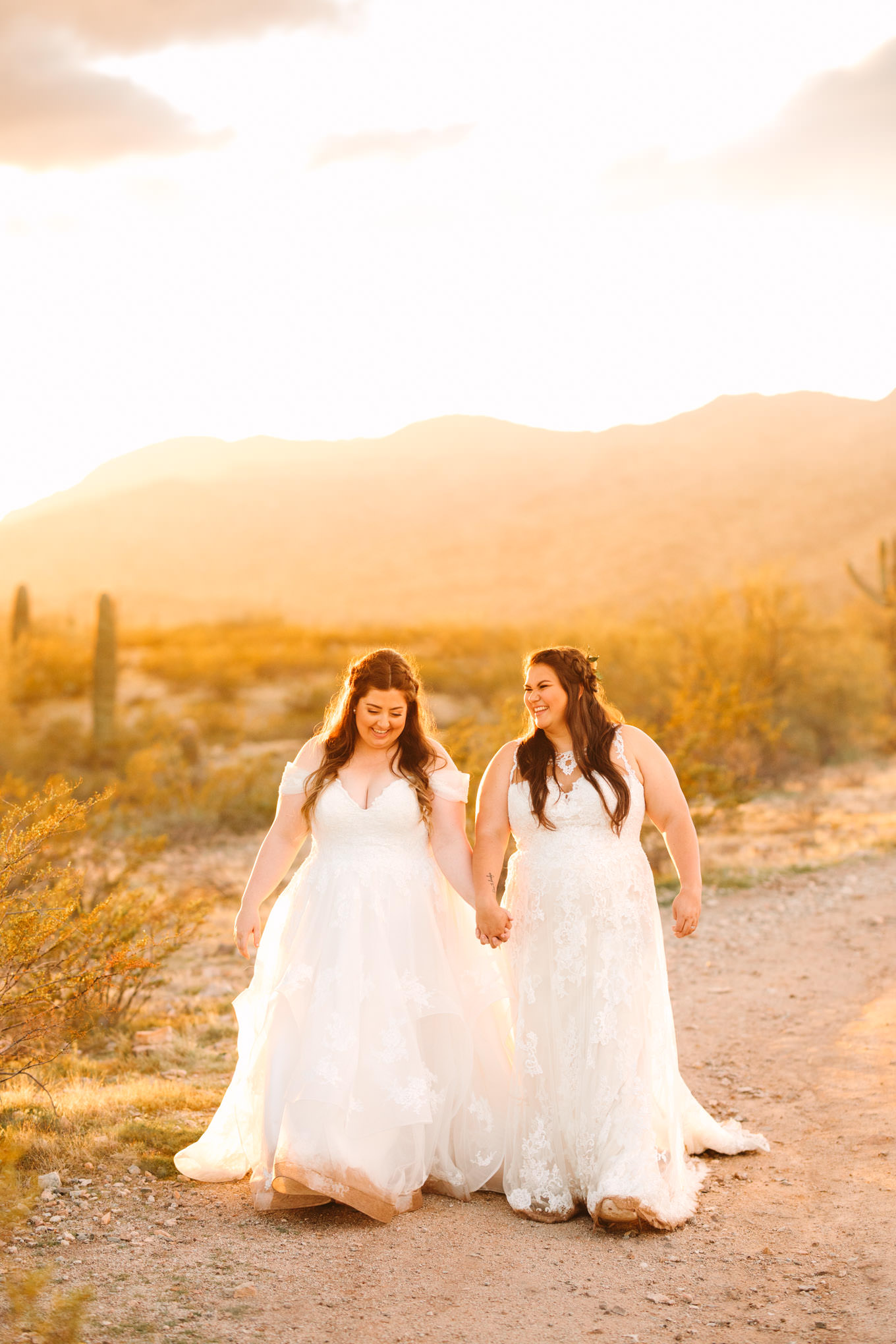 Two brides walking and laughing at sunset | Engagement, elopement, and wedding photography roundup of Mary Costa’s favorite images from 2020 | Colorful and elevated photography for fun-loving couples in Southern California | #2020wedding #elopement #weddingphoto #weddingphotography   Source: Mary Costa Photography | Los Angeles