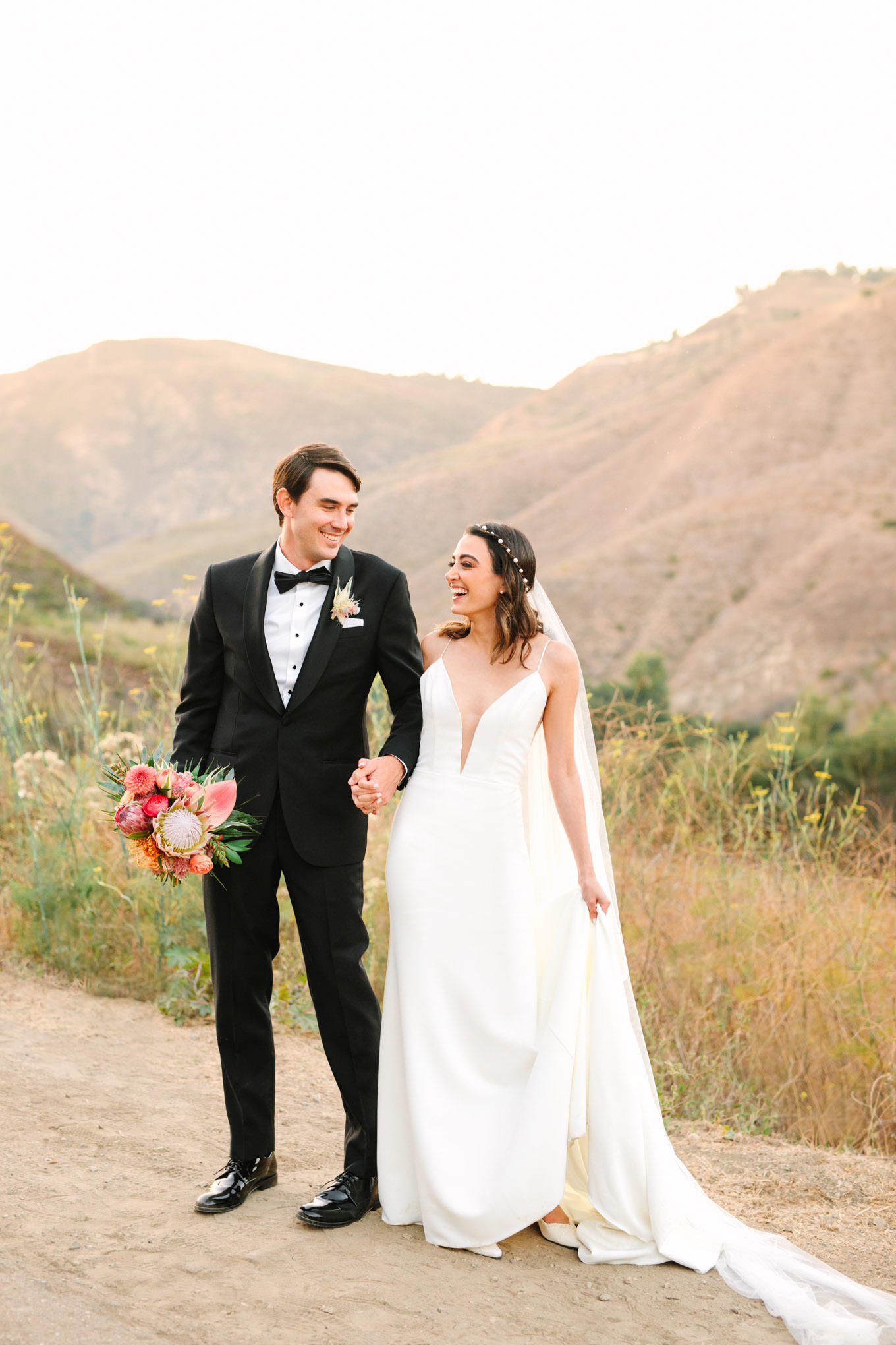 Bride and groom laughing at Malibu Canyon micro wedding | Engagement, elopement, and wedding photography roundup of Mary Costa’s favorite images from 2020 | Colorful and elevated photography for fun-loving couples in Southern California | #2020wedding #elopement #weddingphoto #weddingphotography #microwedding   Source: Mary Costa Photography | Los Angeles