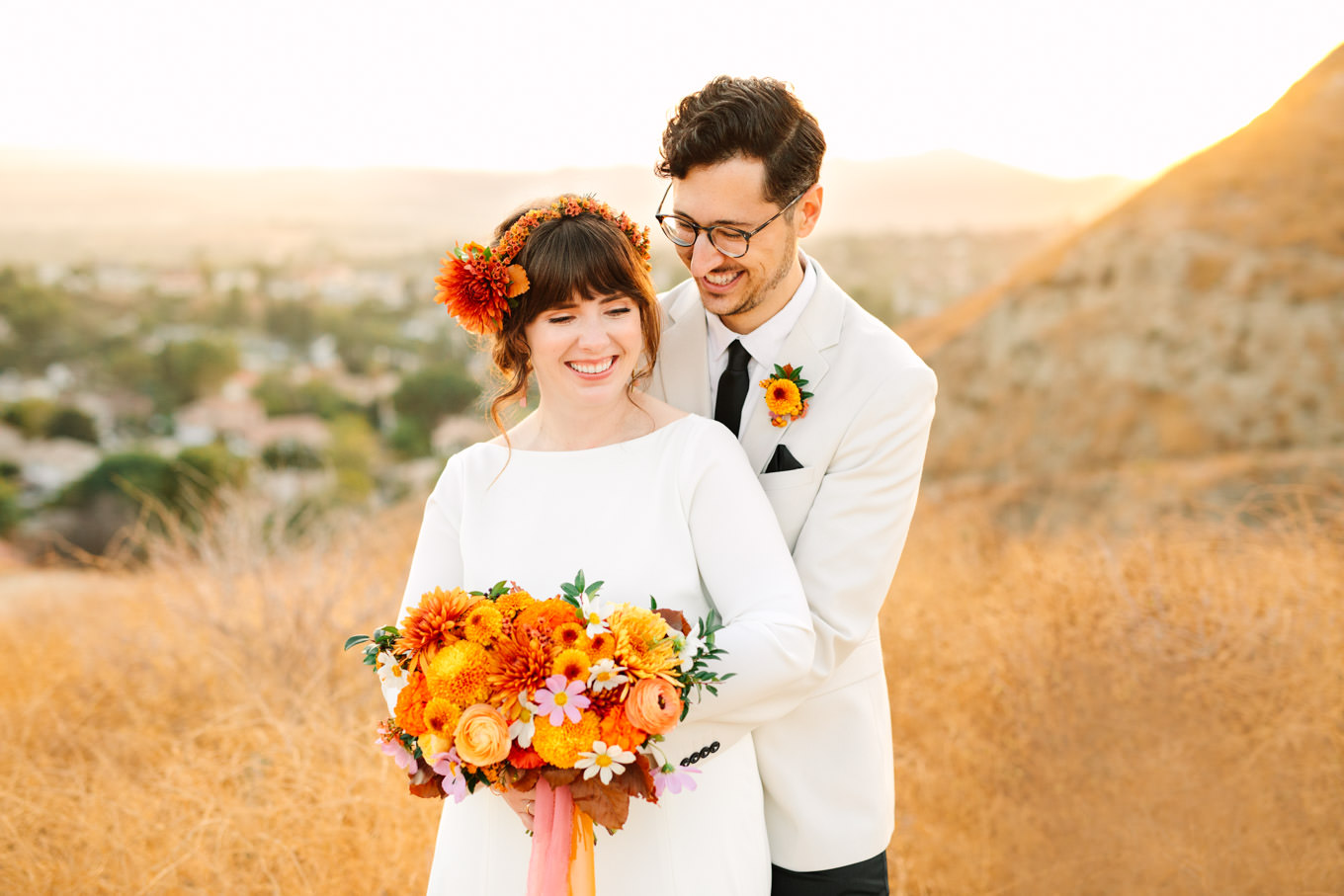 Bride with colorful autumn flowers and groom in cream tux | Engagement, elopement, and wedding photography roundup of Mary Costa’s favorite images from 2020 | Colorful and elevated photography for fun-loving couples in Southern California | #2020wedding #elopement #weddingphoto #weddingphotography #microwedding   Source: Mary Costa Photography | Los Angeles