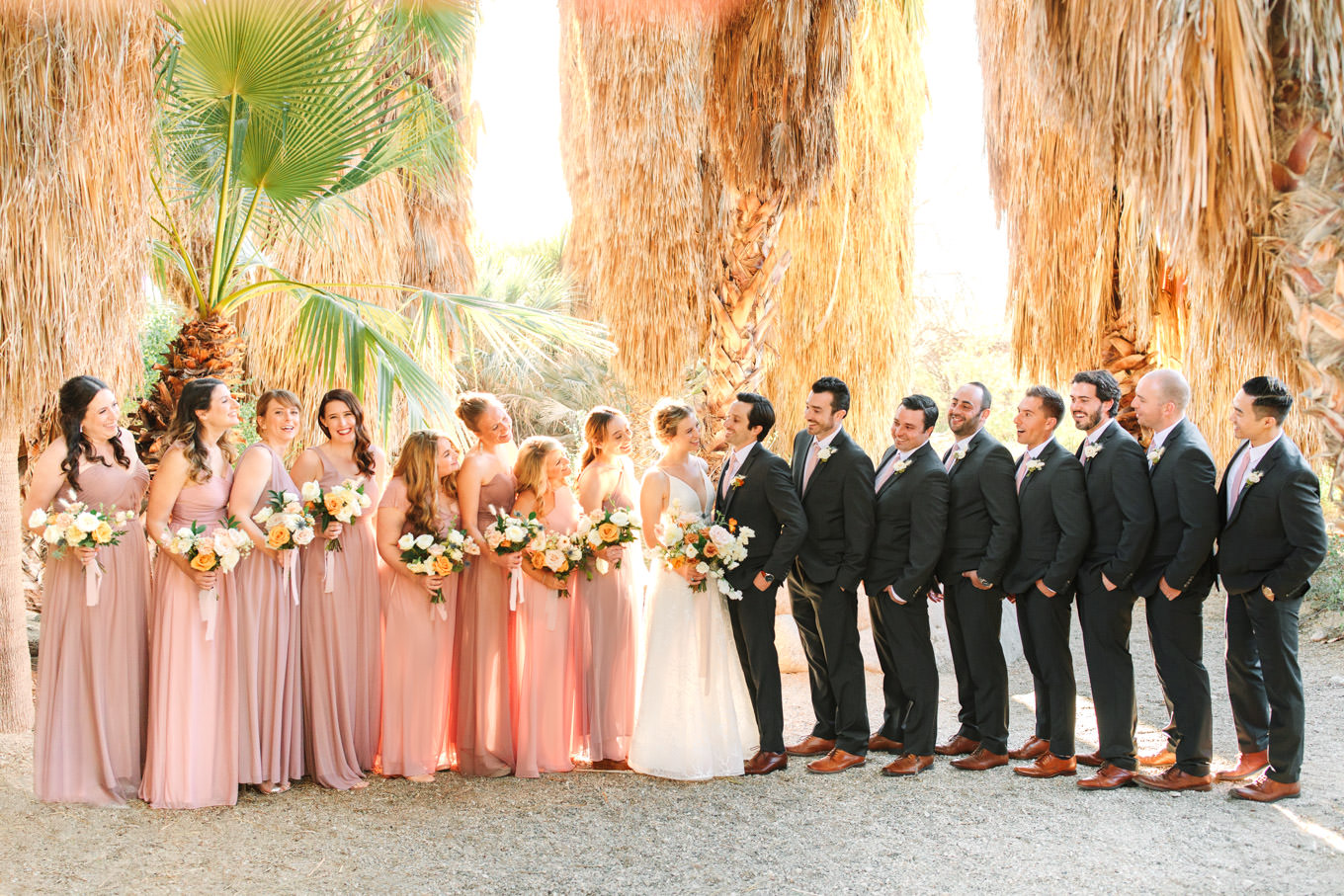 Wedding party in palm garden | Living Desert Zoo & Gardens wedding with unique details | Elevated and colorful wedding photography for fun-loving couples in Southern California |  #PalmSprings #palmspringsphotographer #gardenwedding #palmspringswedding  Source: Mary Costa Photography | Los Angeles wedding photographer 