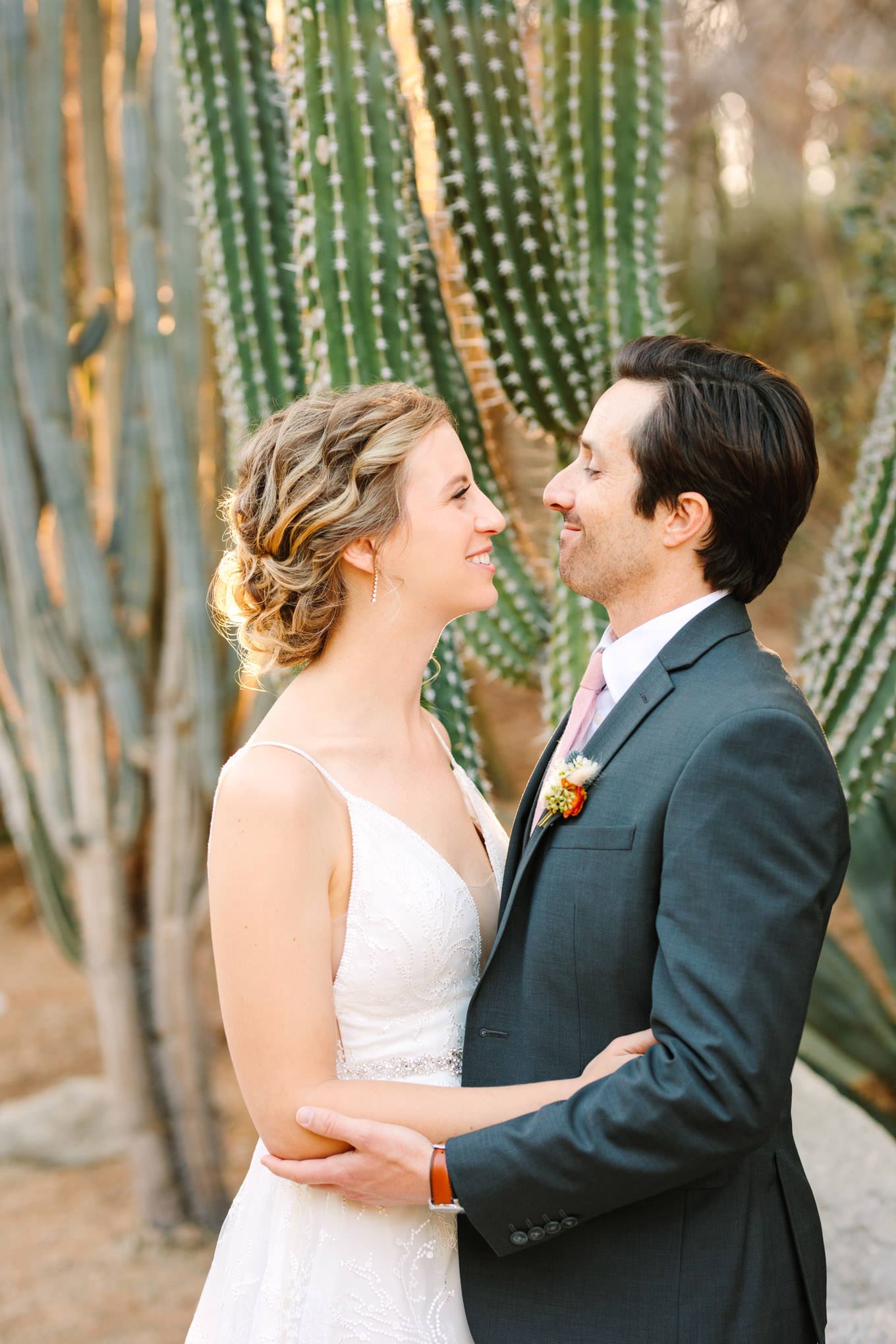 Bride and groom in cactus garden | Living Desert Zoo & Gardens wedding with unique details | Elevated and colorful wedding photography for fun-loving couples in Southern California |  #PalmSprings #palmspringsphotographer #gardenwedding #palmspringswedding  Source: Mary Costa Photography | Los Angeles wedding photographer 