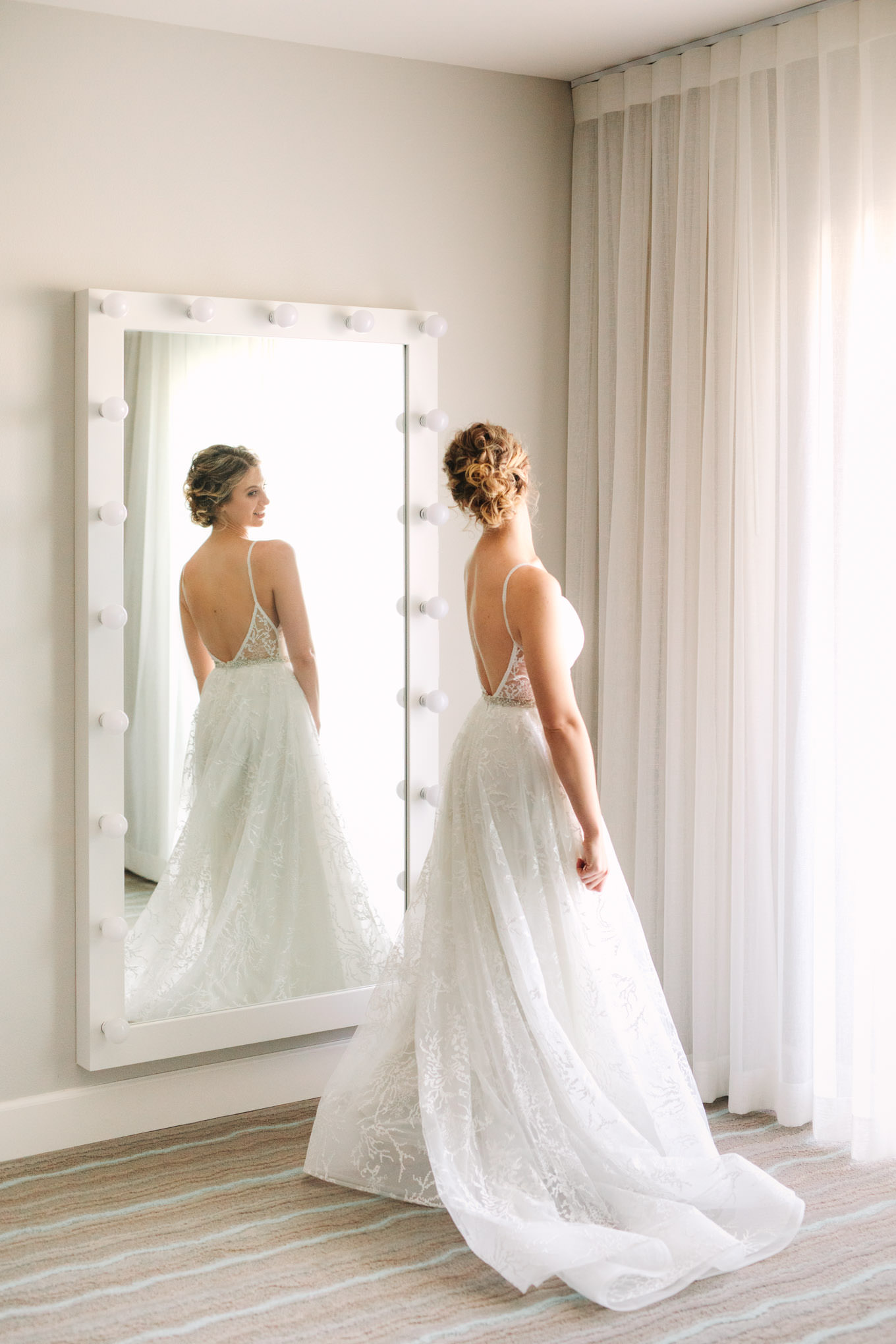 Bride getting ready at Hotel Paseo | Living Desert Zoo & Gardens wedding with unique details | Elevated and colorful wedding photography for fun-loving couples in Southern California |  #PalmSprings #palmspringsphotographer #gardenwedding #palmspringswedding  Source: Mary Costa Photography | Los Angeles wedding photographer 