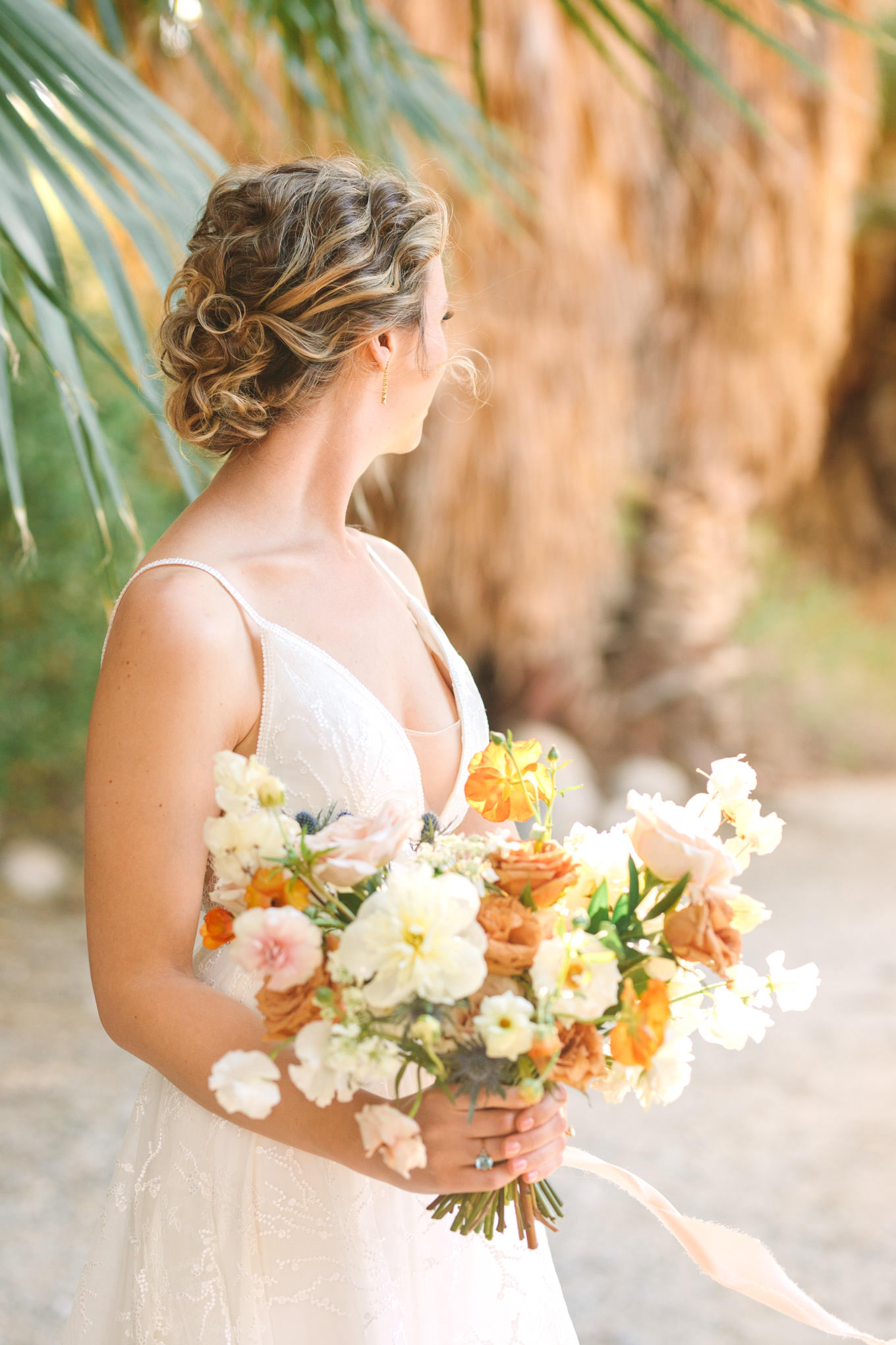 Bridal updo | Living Desert Zoo & Gardens wedding with unique details | Elevated and colorful wedding photography for fun-loving couples in Southern California |  #PalmSprings #palmspringsphotographer #gardenwedding #palmspringswedding  Source: Mary Costa Photography | Los Angeles wedding photographer 