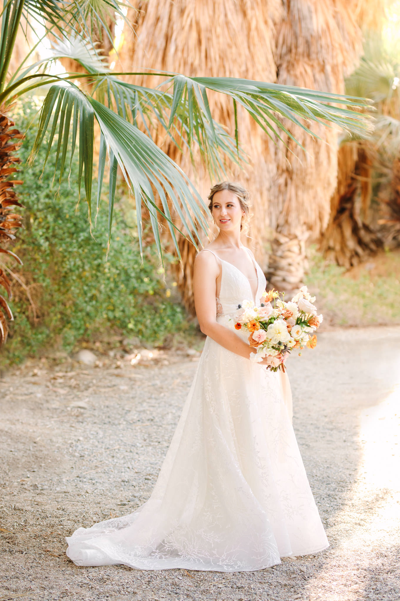 Bride in palm garden | Living Desert Zoo & Gardens wedding with unique details | Elevated and colorful wedding photography for fun-loving couples in Southern California |  #PalmSprings #palmspringsphotographer #gardenwedding #palmspringswedding  Source: Mary Costa Photography | Los Angeles wedding photographer 