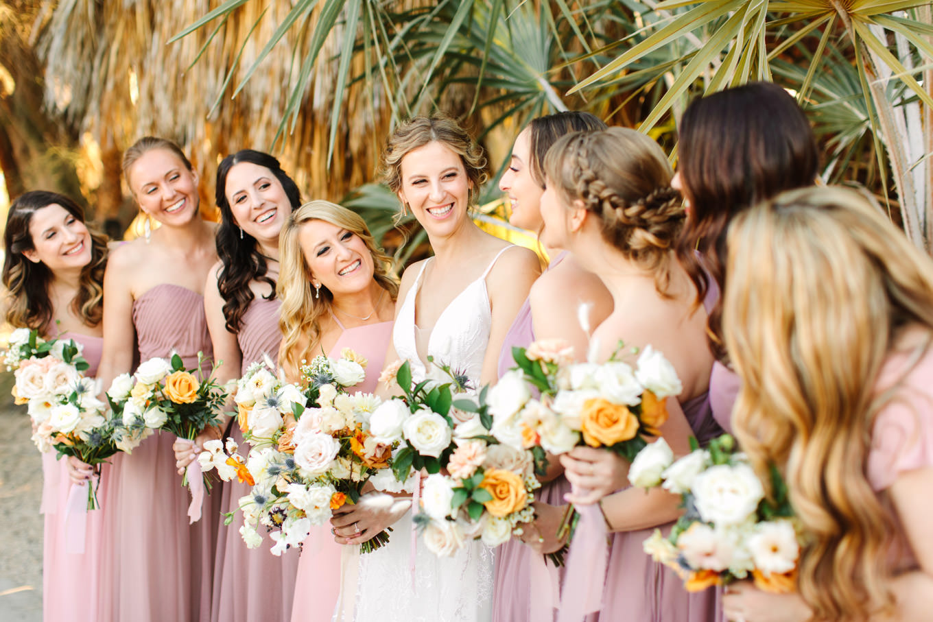 Bridesmaids in mismatched blush and mauve dresses | Living Desert Zoo & Gardens wedding with unique details | Elevated and colorful wedding photography for fun-loving couples in Southern California |  #PalmSprings #palmspringsphotographer #gardenwedding #palmspringswedding  Source: Mary Costa Photography | Los Angeles wedding photographer 