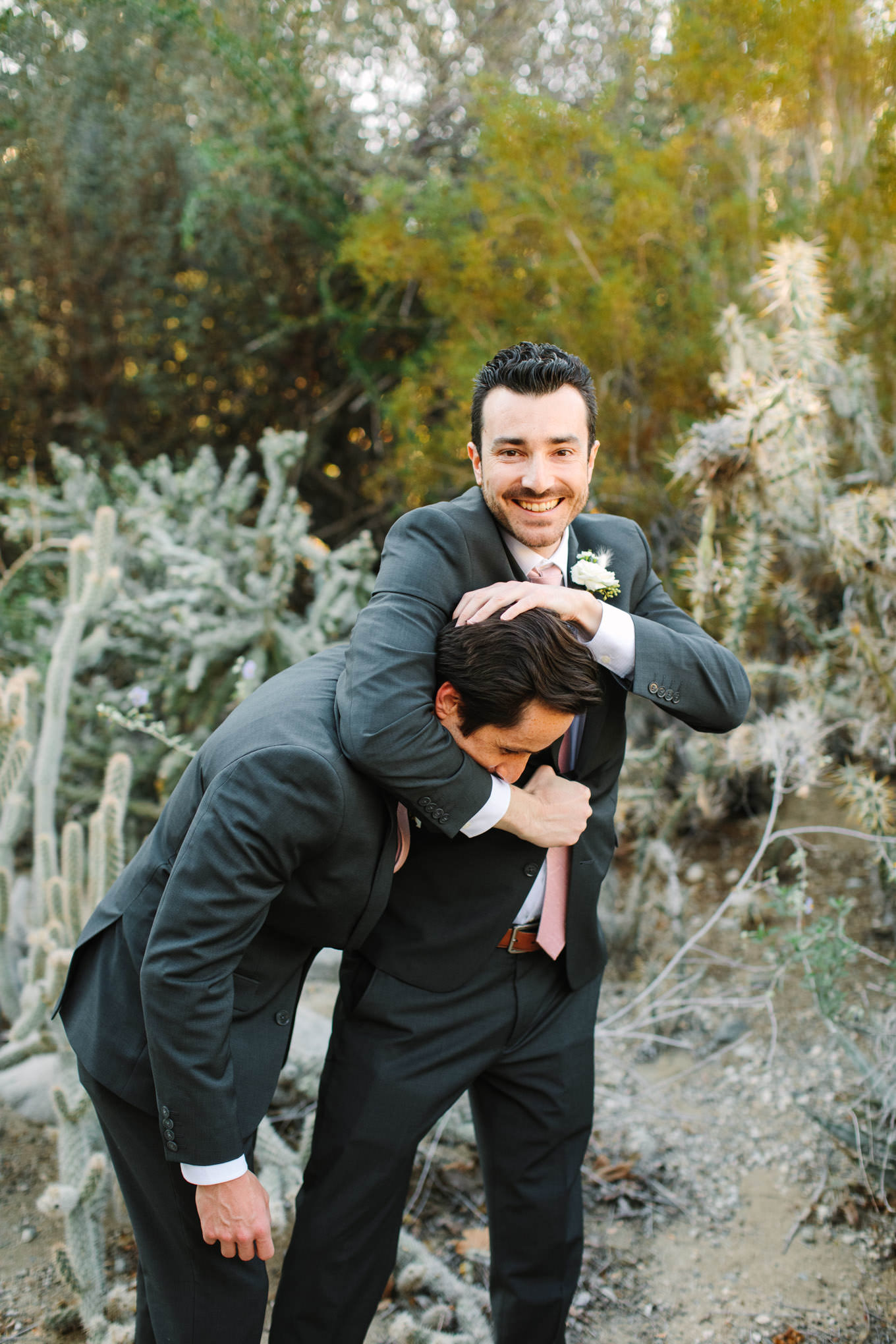 Groom and groomsman fun portrait | Living Desert Zoo & Gardens wedding with unique details | Elevated and colorful wedding photography for fun-loving couples in Southern California |  #PalmSprings #palmspringsphotographer #gardenwedding #palmspringswedding  Source: Mary Costa Photography | Los Angeles wedding photographer 