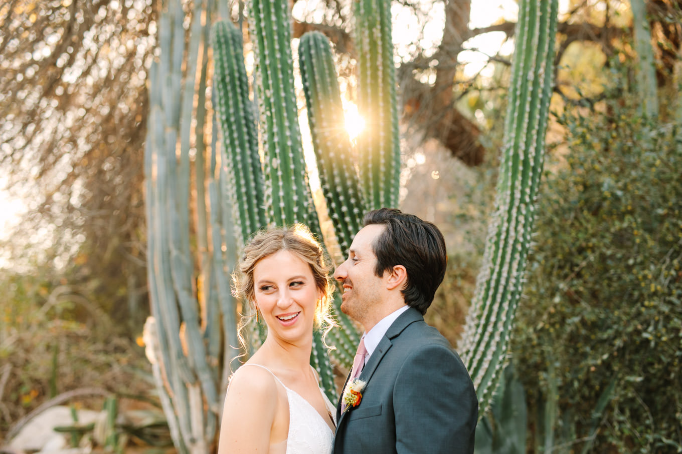 Wedding portrait of bride and groom in cactus garden | Living Desert Zoo & Gardens wedding with unique details | Elevated and colorful wedding photography for fun-loving couples in Southern California |  #PalmSprings #palmspringsphotographer #gardenwedding #palmspringswedding  Source: Mary Costa Photography | Los Angeles wedding photographer 