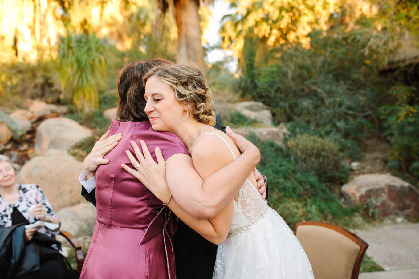 Bride and mom hugging | Living Desert Zoo & Gardens wedding with unique details | Elevated and colorful wedding photography for fun-loving couples in Southern California |  #PalmSprings #palmspringsphotographer #gardenwedding #palmspringswedding  Source: Mary Costa Photography | Los Angeles wedding photographer 