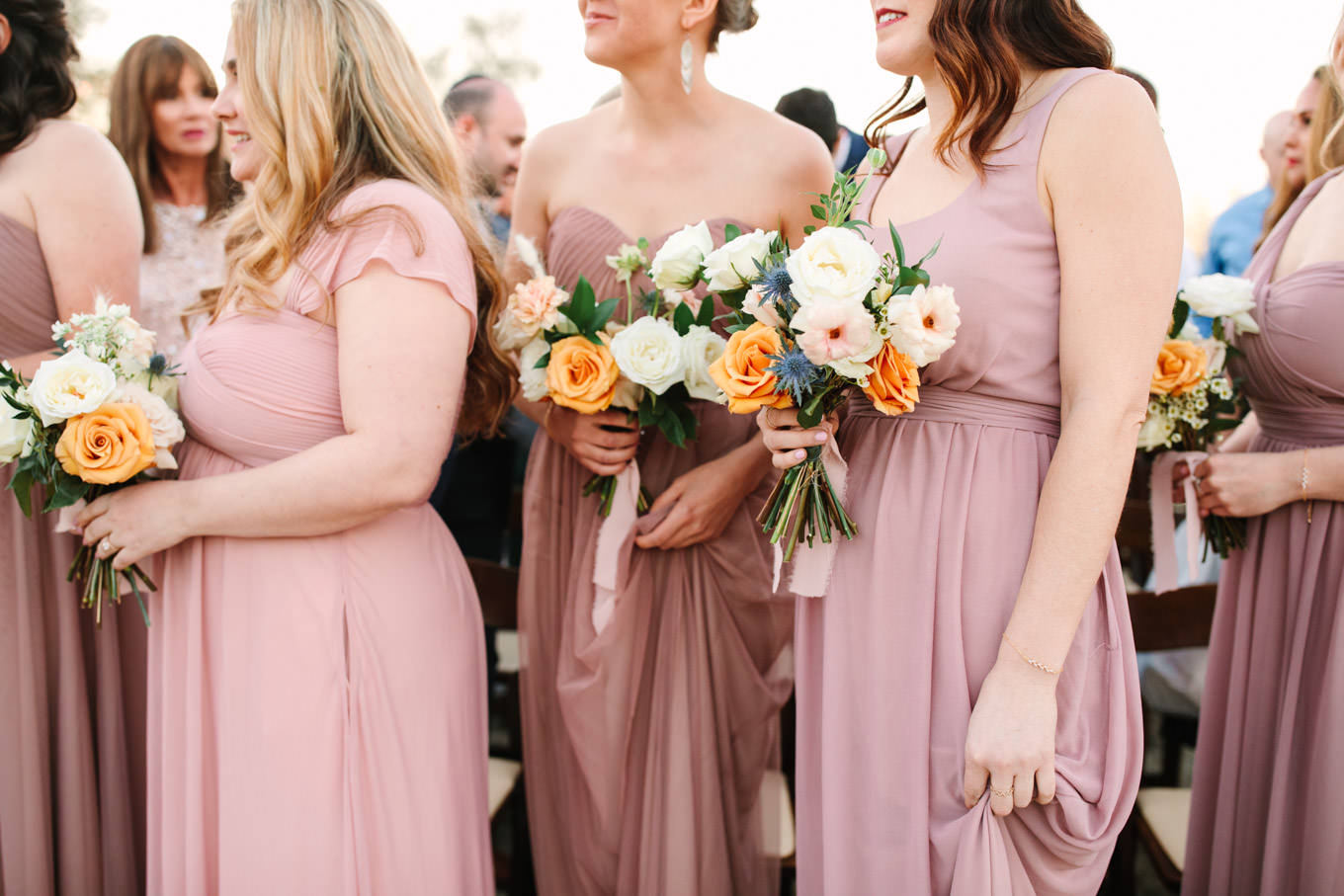 Candid of bridesmaids at wedding ceremony | Living Desert Zoo & Gardens wedding with unique details | Elevated and colorful wedding photography for fun-loving couples in Southern California |  #PalmSprings #palmspringsphotographer #gardenwedding #palmspringswedding  Source: Mary Costa Photography | Los Angeles wedding photographer 