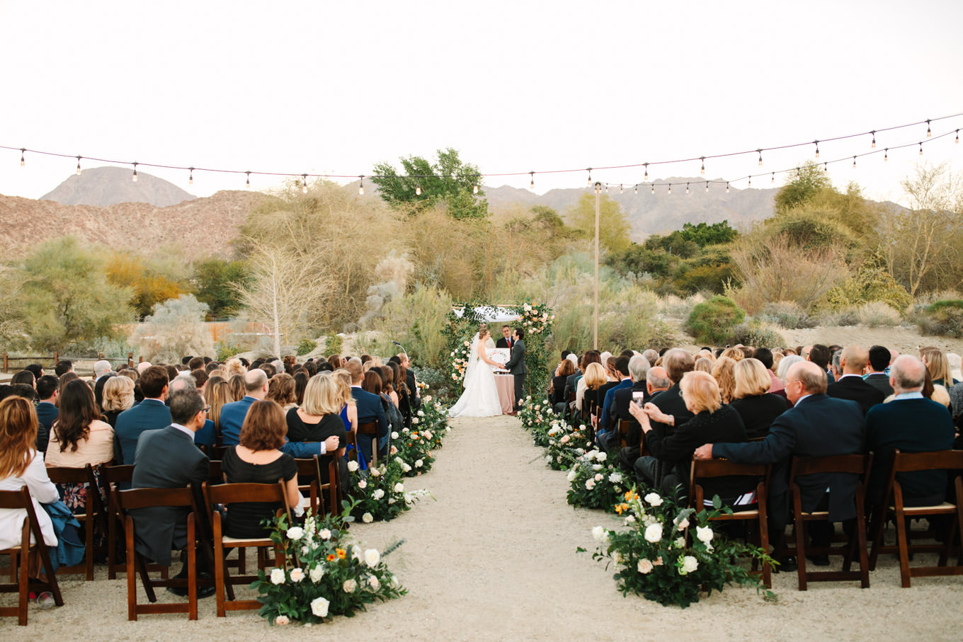 Wedding ceremony at sunset | Living Desert Zoo & Gardens wedding with unique details | Elevated and colorful wedding photography for fun-loving couples in Southern California |  #PalmSprings #palmspringsphotographer #gardenwedding #palmspringswedding  Source: Mary Costa Photography | Los Angeles wedding photographer 