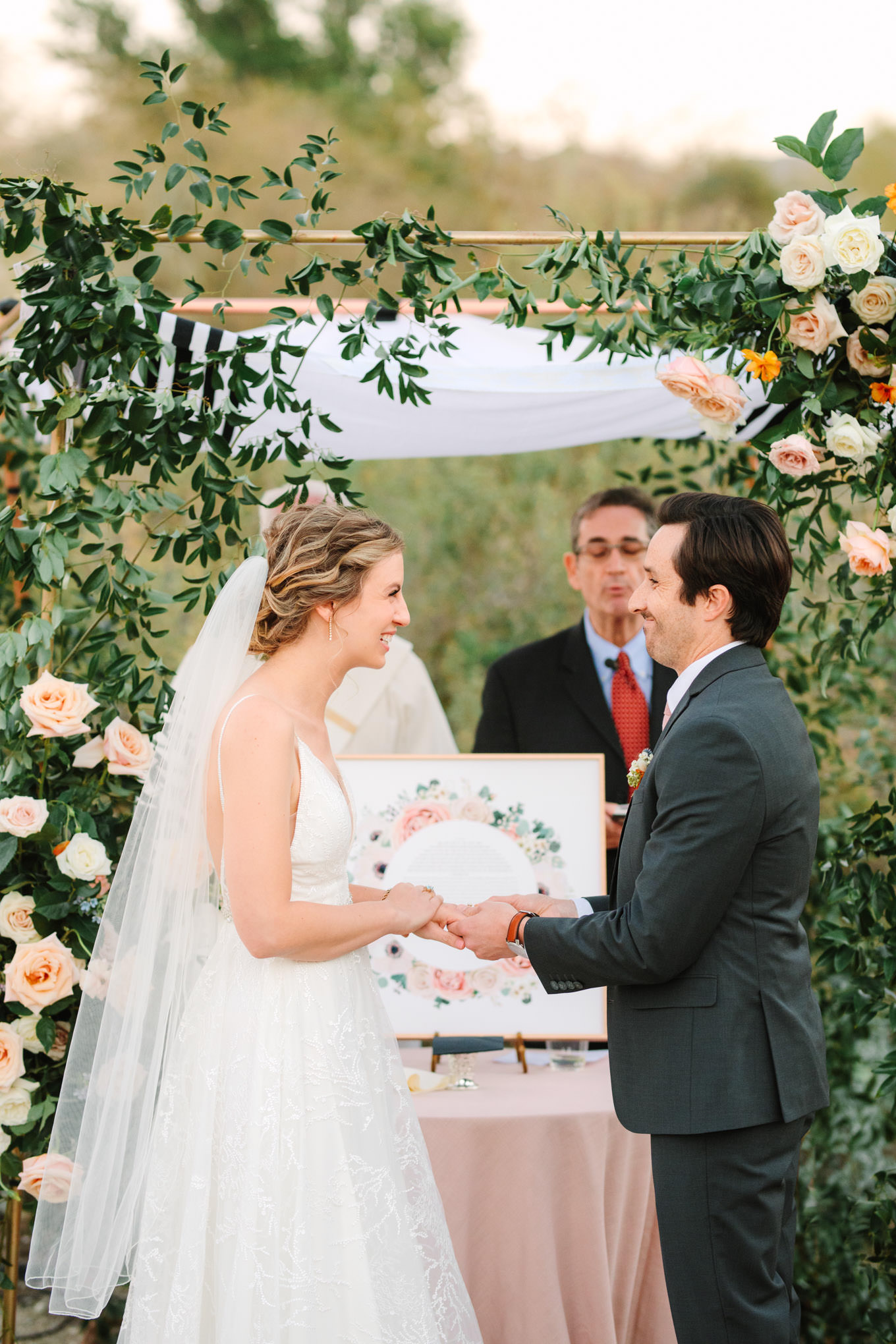 Bride and groom exchanging rings | Living Desert Zoo & Gardens wedding with unique details | Elevated and colorful wedding photography for fun-loving couples in Southern California |  #PalmSprings #palmspringsphotographer #gardenwedding #palmspringswedding  Source: Mary Costa Photography | Los Angeles wedding photographer 