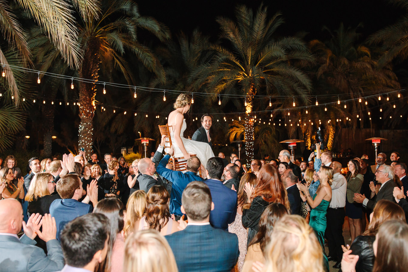 Wedding reception during Horah | Living Desert Zoo & Gardens wedding with unique details | Elevated and colorful wedding photography for fun-loving couples in Southern California |  #PalmSprings #palmspringsphotographer #gardenwedding #palmspringswedding  Source: Mary Costa Photography | Los Angeles wedding photographer 