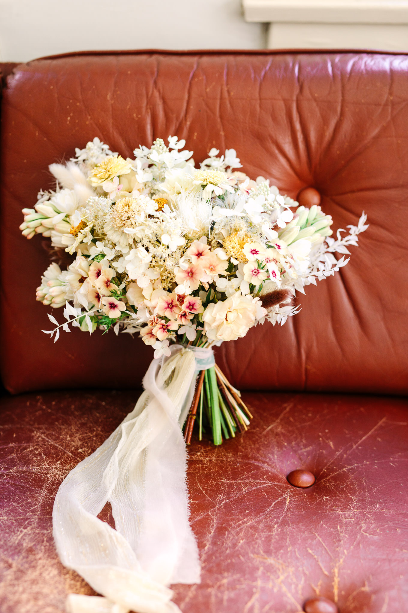 Neutral boho bridal bouquet by Shindig Chic | Los Angeles Arboretum Elopement | Colorful and elevated wedding photography for fun-loving couples in Southern California | #LosAngelesElopement #elopement #LAarboretum #LAskyline #elopementphotos   Source: Mary Costa Photography | Los Angeles