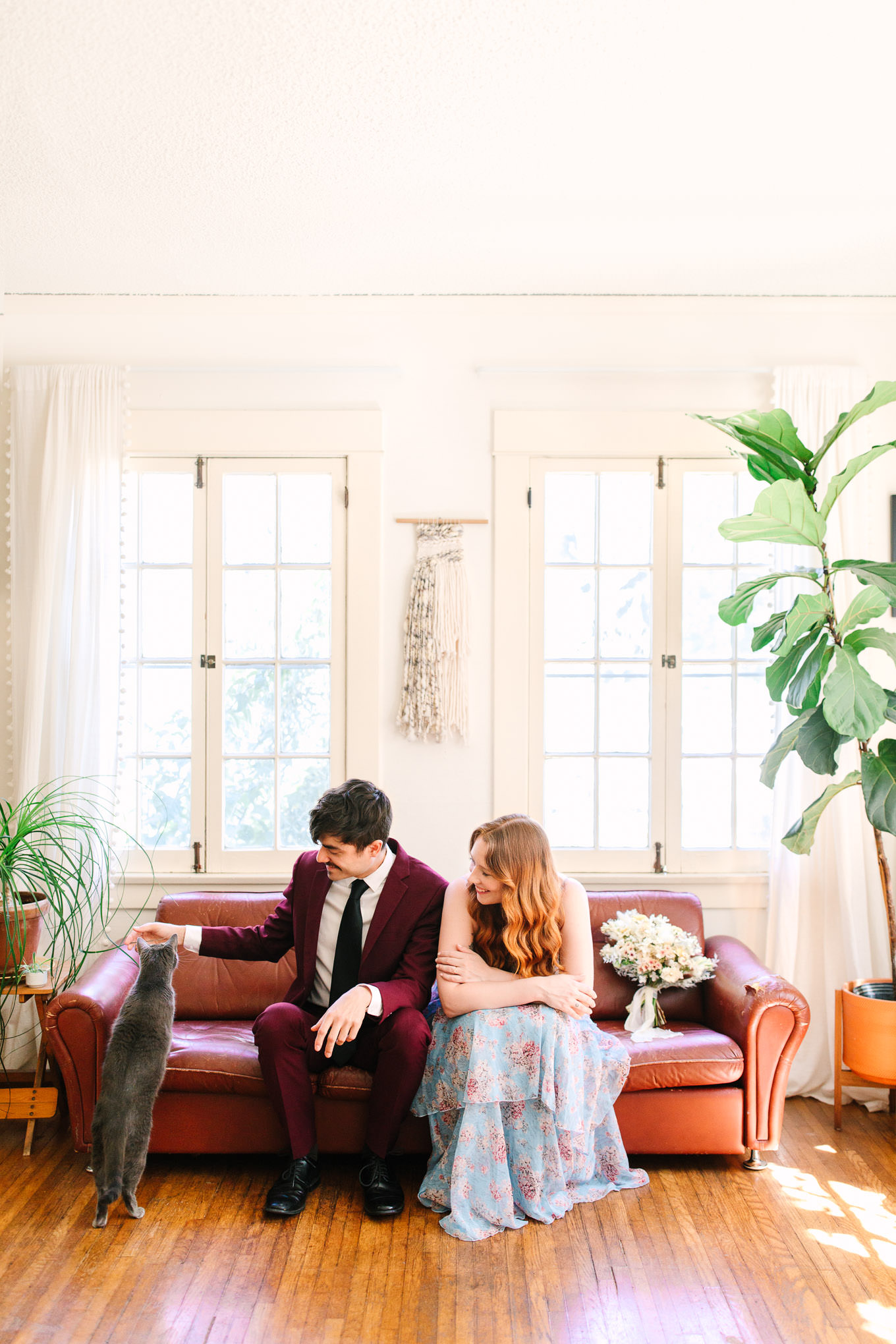 Couple playing with their cat at home | Los Angeles Arboretum Elopement | Colorful and elevated wedding photography for fun-loving couples in Southern California | #LosAngelesElopement #elopement #LAarboretum #LAskyline #elopementphotos   Source: Mary Costa Photography | Los Angeles