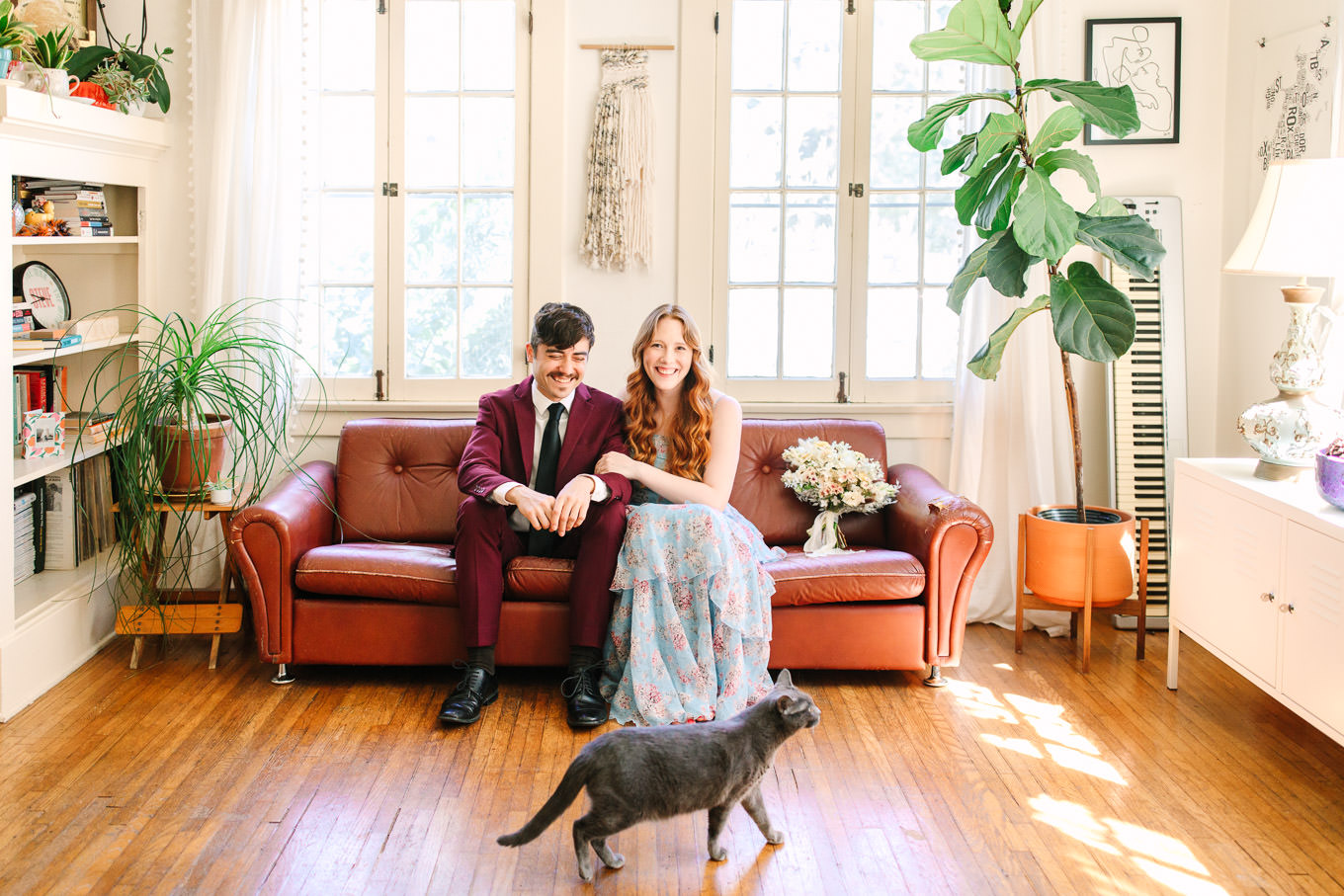 Couple laughing at home with their cat | Los Angeles Arboretum Elopement | Colorful and elevated wedding photography for fun-loving couples in Southern California | #LosAngelesElopement #elopement #LAarboretum #LAskyline #elopementphotos   Source: Mary Costa Photography | Los Angeles