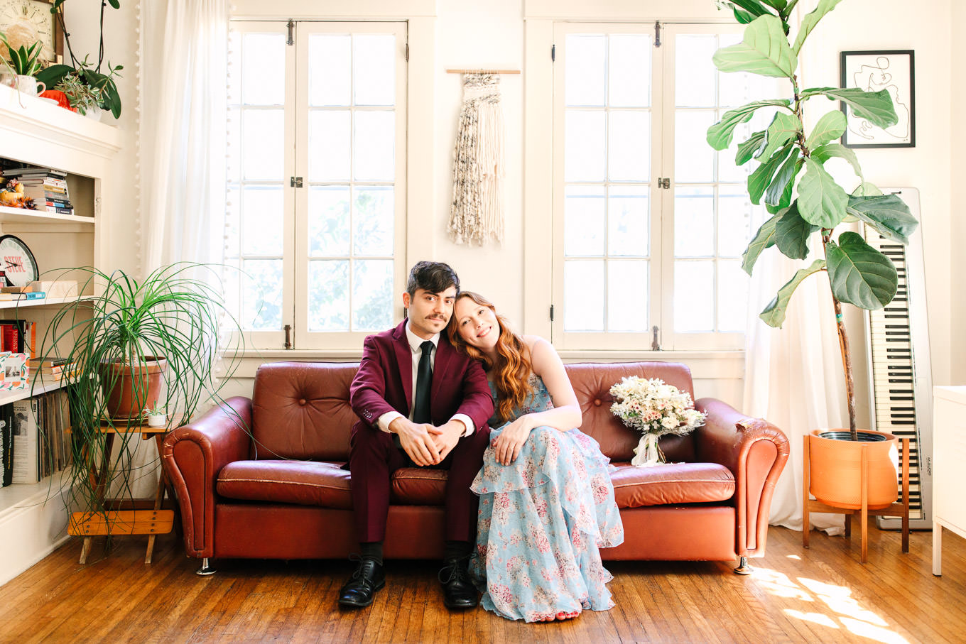 Couple relaxing at home in fancy attire | Los Angeles Arboretum Elopement | Colorful and elevated wedding photography for fun-loving couples in Southern California | #LosAngelesElopement #elopement #LAarboretum #LAskyline #elopementphotos   Source: Mary Costa Photography | Los Angeles