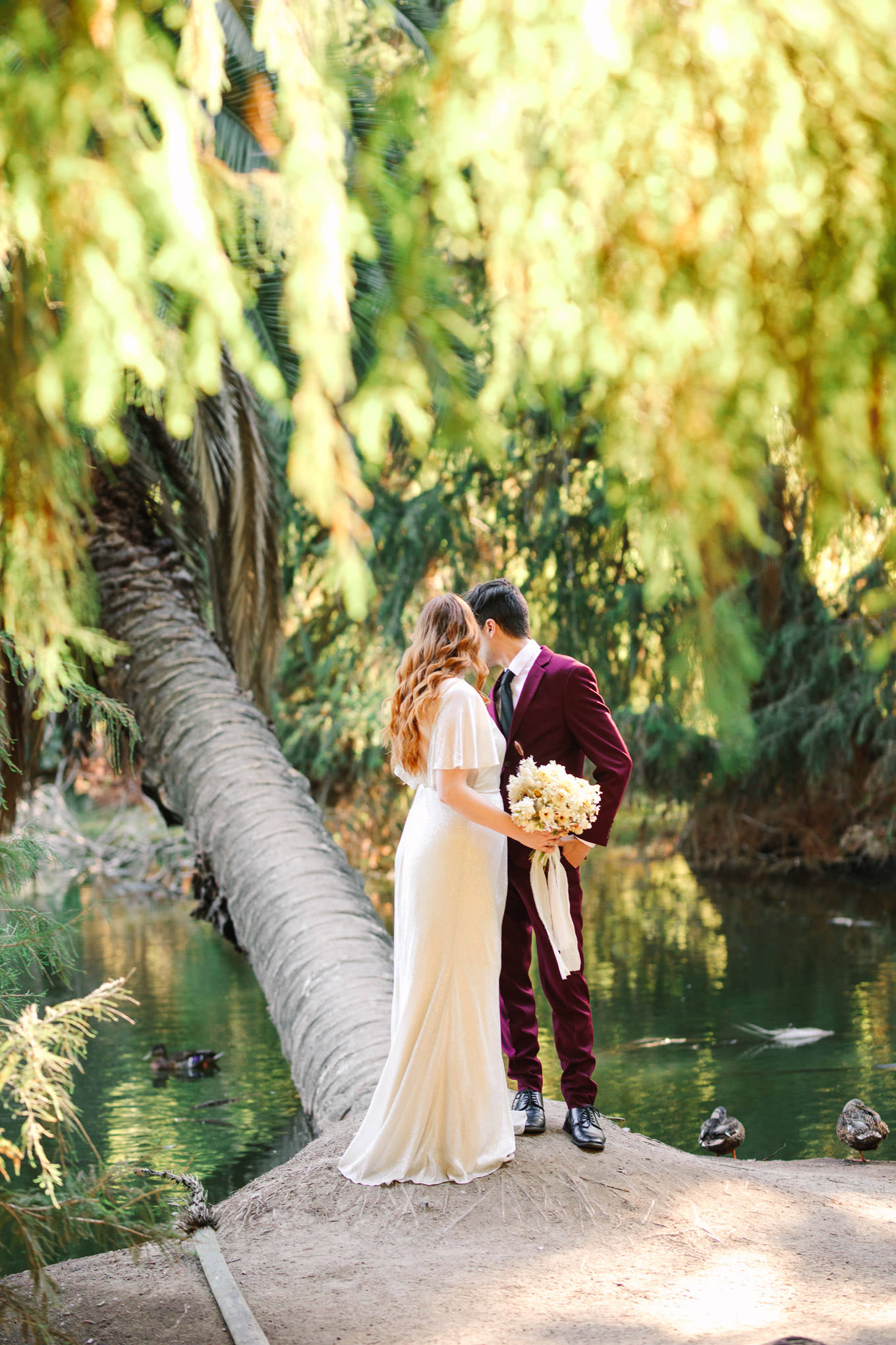 Bride and groom near pond | Los Angeles Arboretum Elopement | Colorful and elevated wedding photography for fun-loving couples in Southern California | #LosAngelesElopement #elopement #LAarboretum #LAskyline #elopementphotos   Source: Mary Costa Photography | Los Angeles