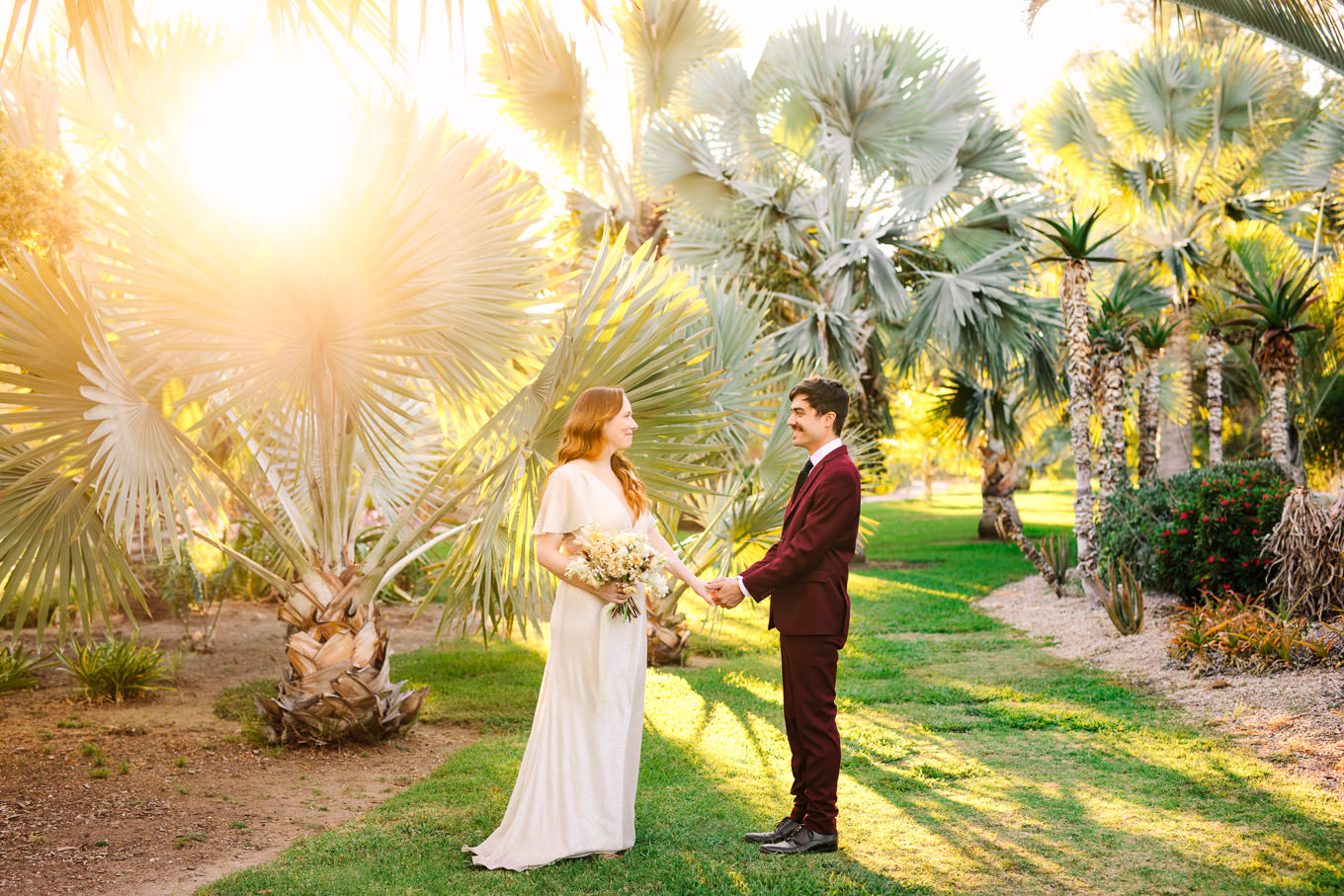 Bride and groom in lush palm garden at sunset | Los Angeles Arboretum Elopement | Colorful and elevated wedding photography for fun-loving couples in Southern California | #LosAngelesElopement #elopement #LAarboretum #LAskyline #elopementphotos   Source: Mary Costa Photography | Los Angeles