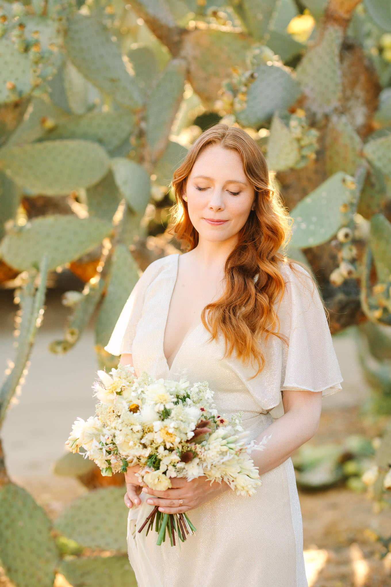 Bride with red hair in front of cacti | Los Angeles Arboretum Elopement | Colorful and elevated wedding photography for fun-loving couples in Southern California | #LosAngelesElopement #elopement #LAarboretum #LAskyline #elopementphotos   Source: Mary Costa Photography | Los Angeles