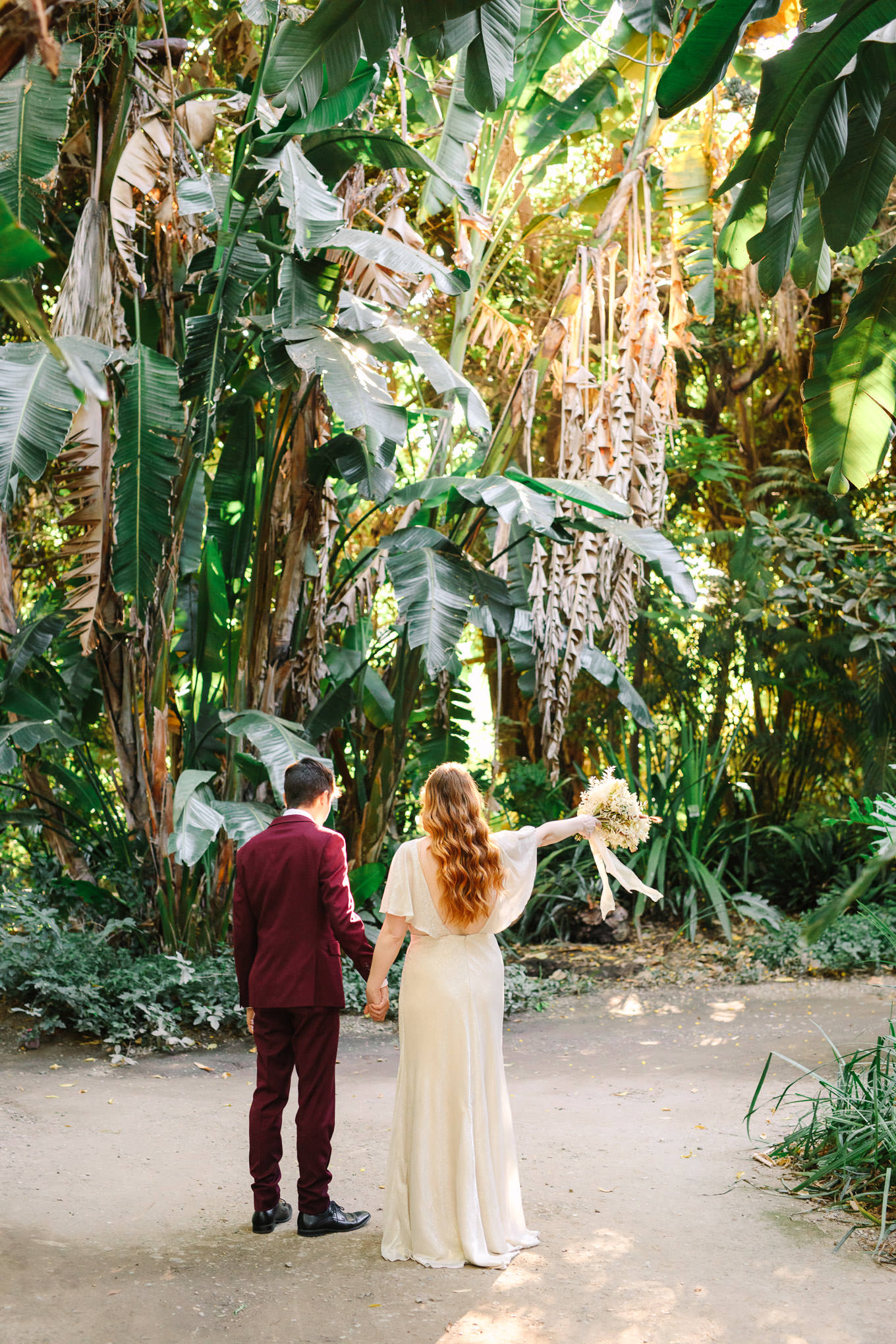 Couple exploring LA Arboretum | Los Angeles Arboretum Elopement | Colorful and elevated wedding photography for fun-loving couples in Southern California | #LosAngelesElopement #elopement #LAarboretum #LAskyline #elopementphotos   Source: Mary Costa Photography | Los Angeles