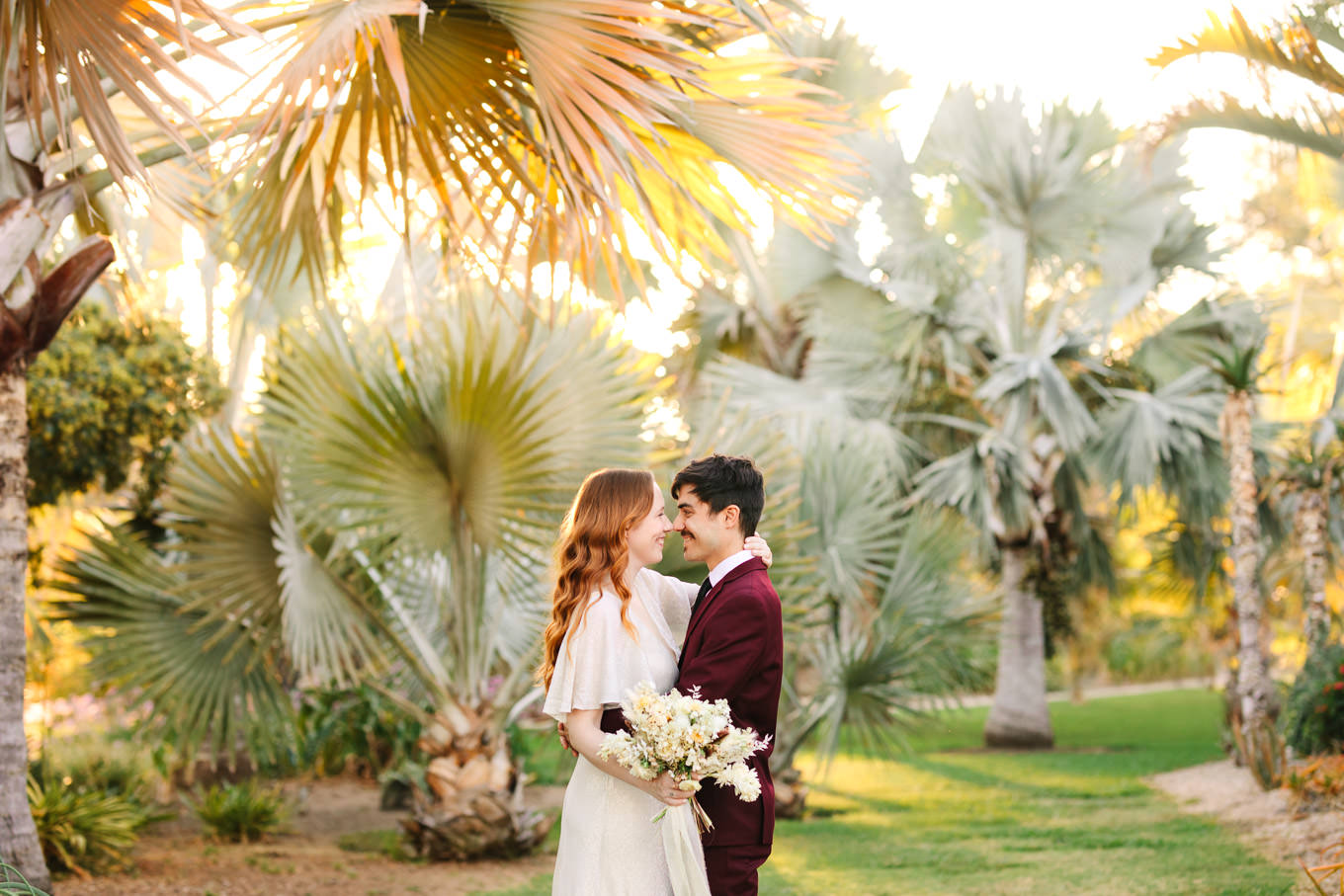 Bride and groom in palm garden | Los Angeles Arboretum Elopement | Colorful and elevated wedding photography for fun-loving couples in Southern California | #LosAngelesElopement #elopement #LAarboretum #LAskyline #elopementphotos   Source: Mary Costa Photography | Los Angeles