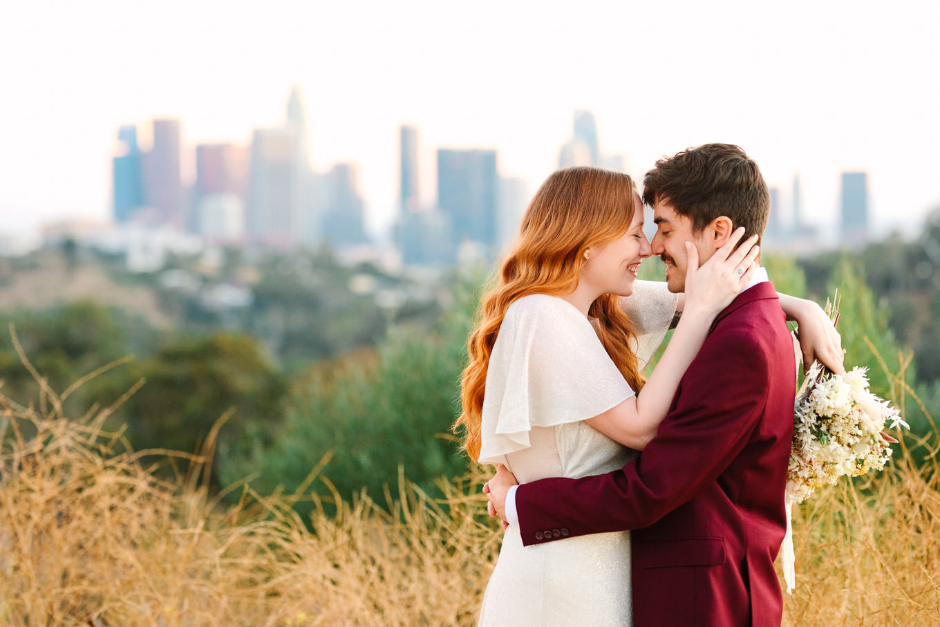 Elopement portrait in front of LA skyline | Los Angeles Elysian Park Elopement | Colorful and elevated wedding photography for fun-loving couples in Southern California | #LosAngelesElopement #elopement #LAarboretum #LAskyline #elopementphotos   Source: Mary Costa Photography | Los Angeles