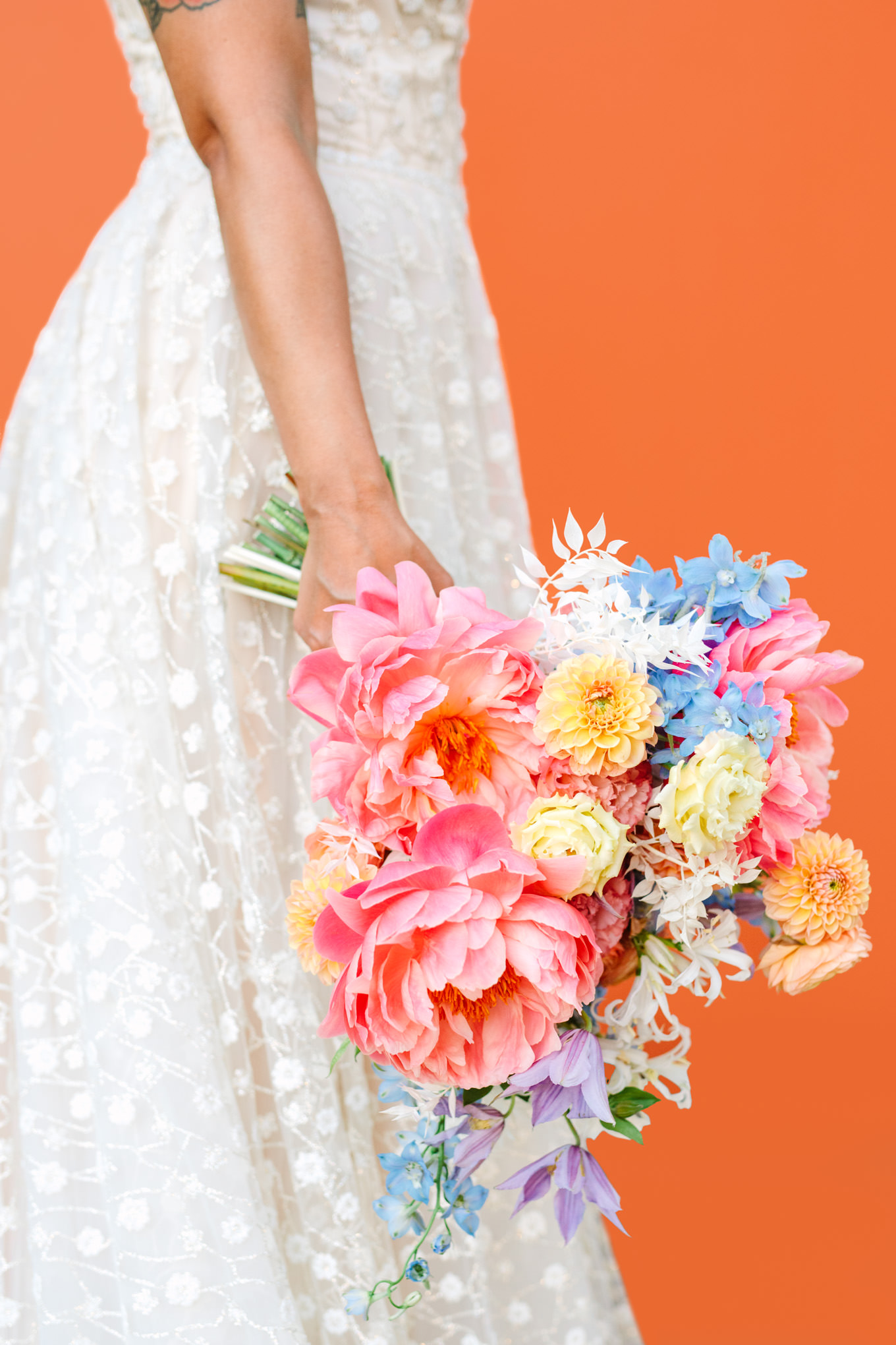 Colorful wedding bouquet on Pronovias gown | Colorful pop-up micro wedding at The Ruby Street Los Angeles featured on Green Wedding Shoes | Colorful and elevated photography for fun-loving couples in Southern California | #colorfulwedding #popupwedding #weddingphotography #microwedding Source: Mary Costa Photography | Los Angeles