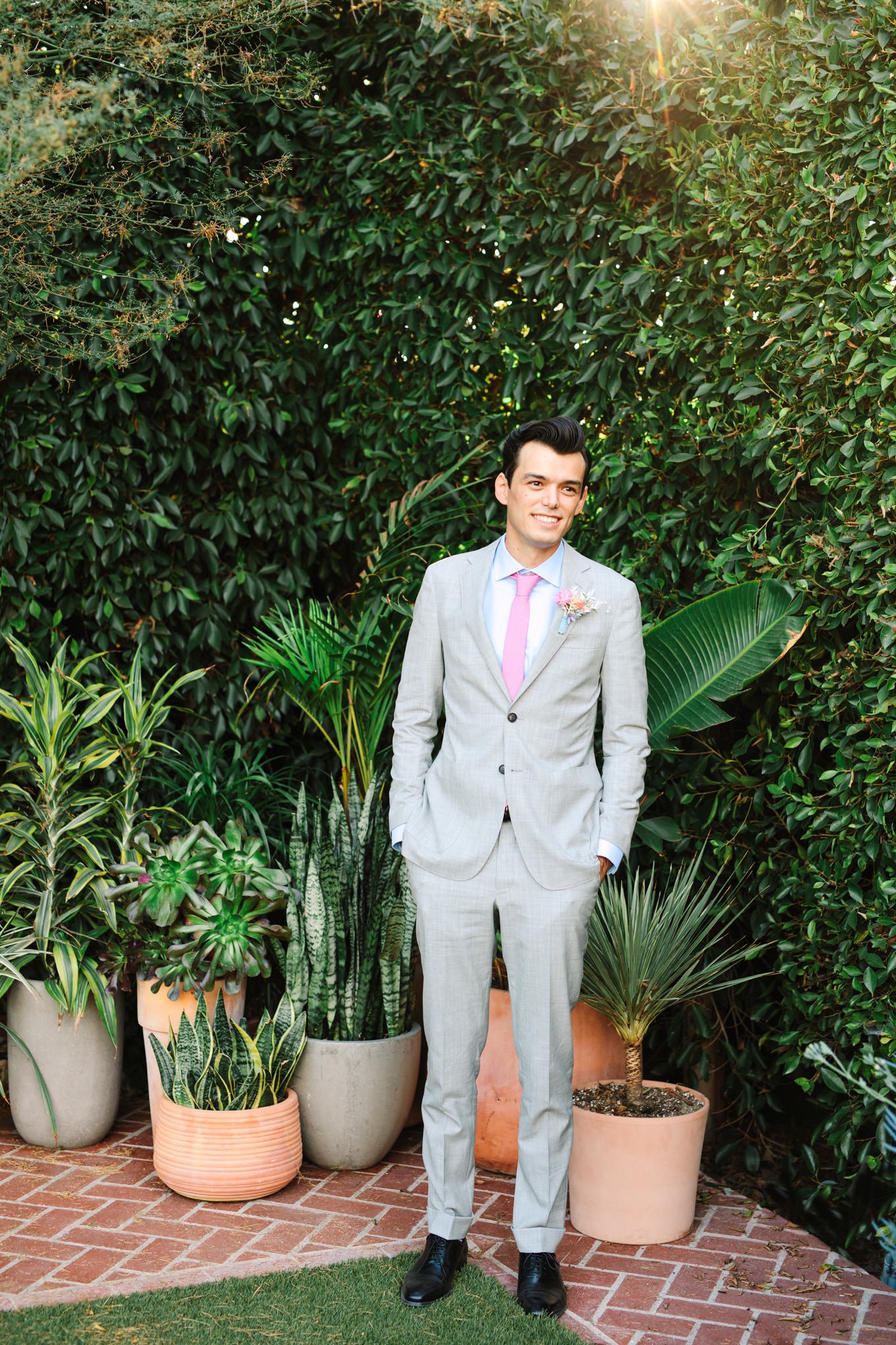 Groom in gray suit with light blue shirt and lavender tie | Colorful pop-up micro wedding at The Ruby Street Los Angeles featured on Green Wedding Shoes | Colorful and elevated photography for fun-loving couples in Southern California | #colorfulwedding #popupwedding #weddingphotography #microwedding Source: Mary Costa Photography | Los Angeles