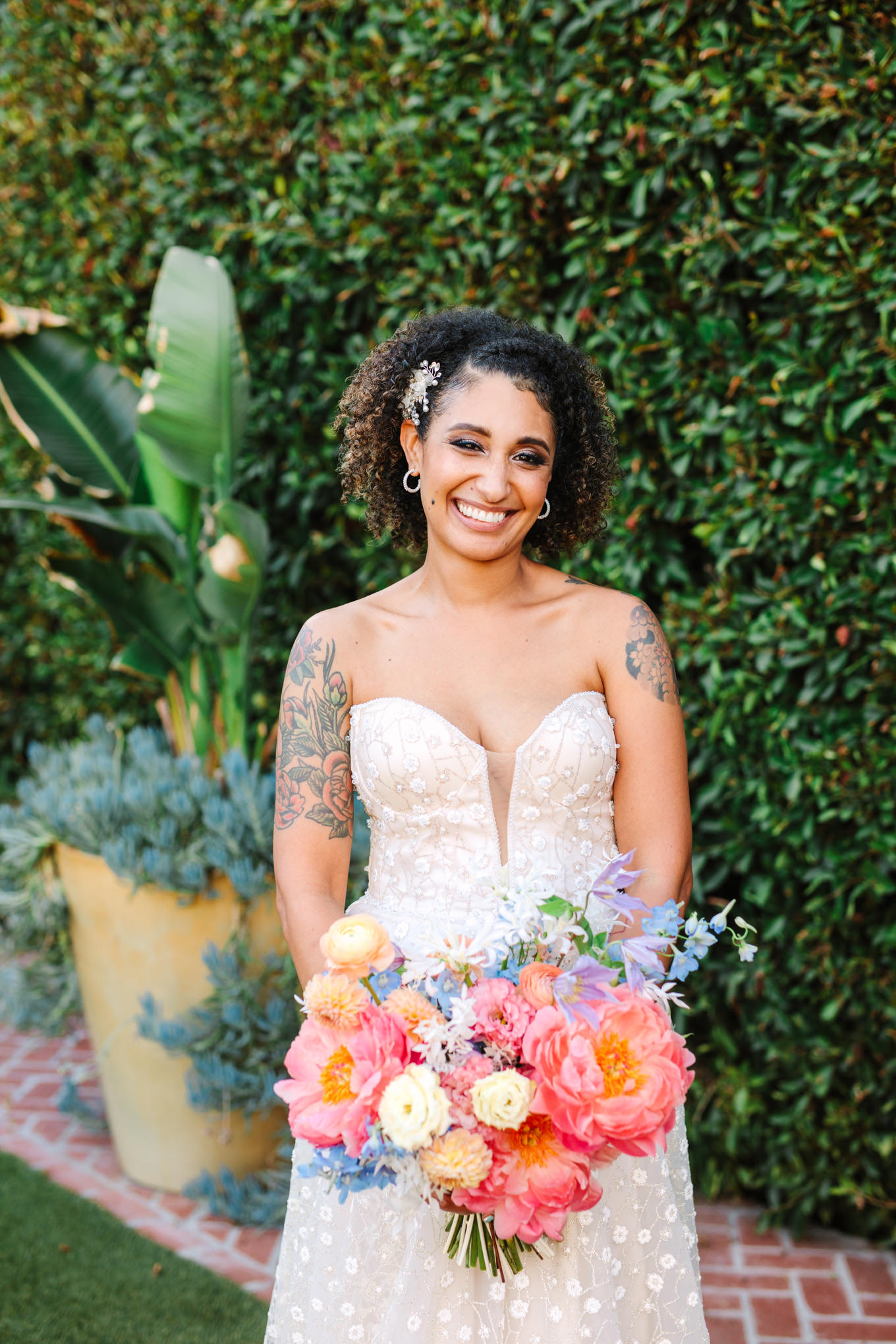 Happy bride in Pronovias gown | Colorful pop-up micro wedding at The Ruby Street Los Angeles featured on Green Wedding Shoes | Colorful and elevated photography for fun-loving couples in Southern California | #colorfulwedding #popupwedding #weddingphotography #microwedding Source: Mary Costa Photography | Los Angeles