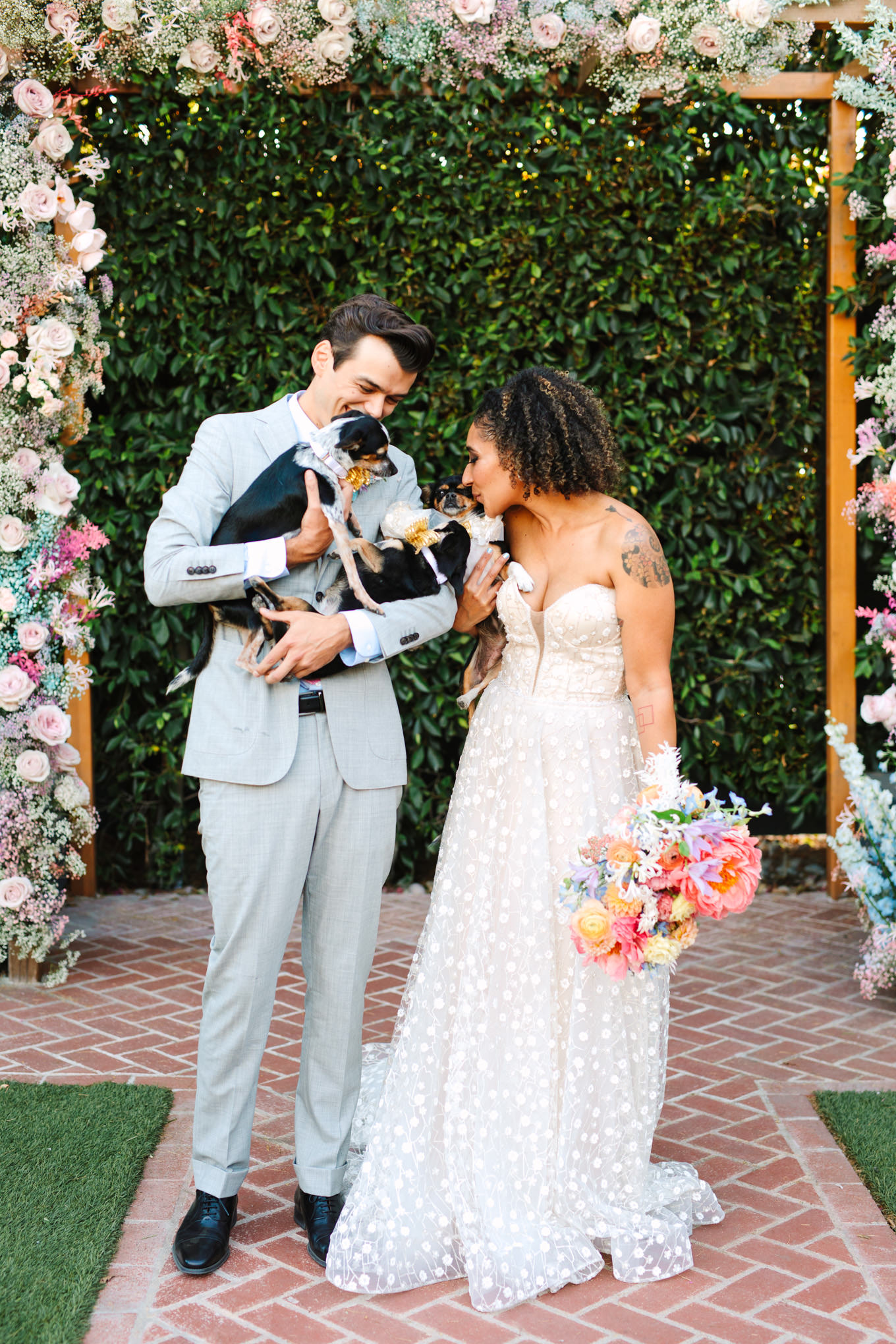 Bride and groom with their three dogs | Colorful pop-up micro wedding at The Ruby Street Los Angeles featured on Green Wedding Shoes | Colorful and elevated photography for fun-loving couples in Southern California | #colorfulwedding #popupwedding #weddingphotography #microwedding Source: Mary Costa Photography | Los Angeles