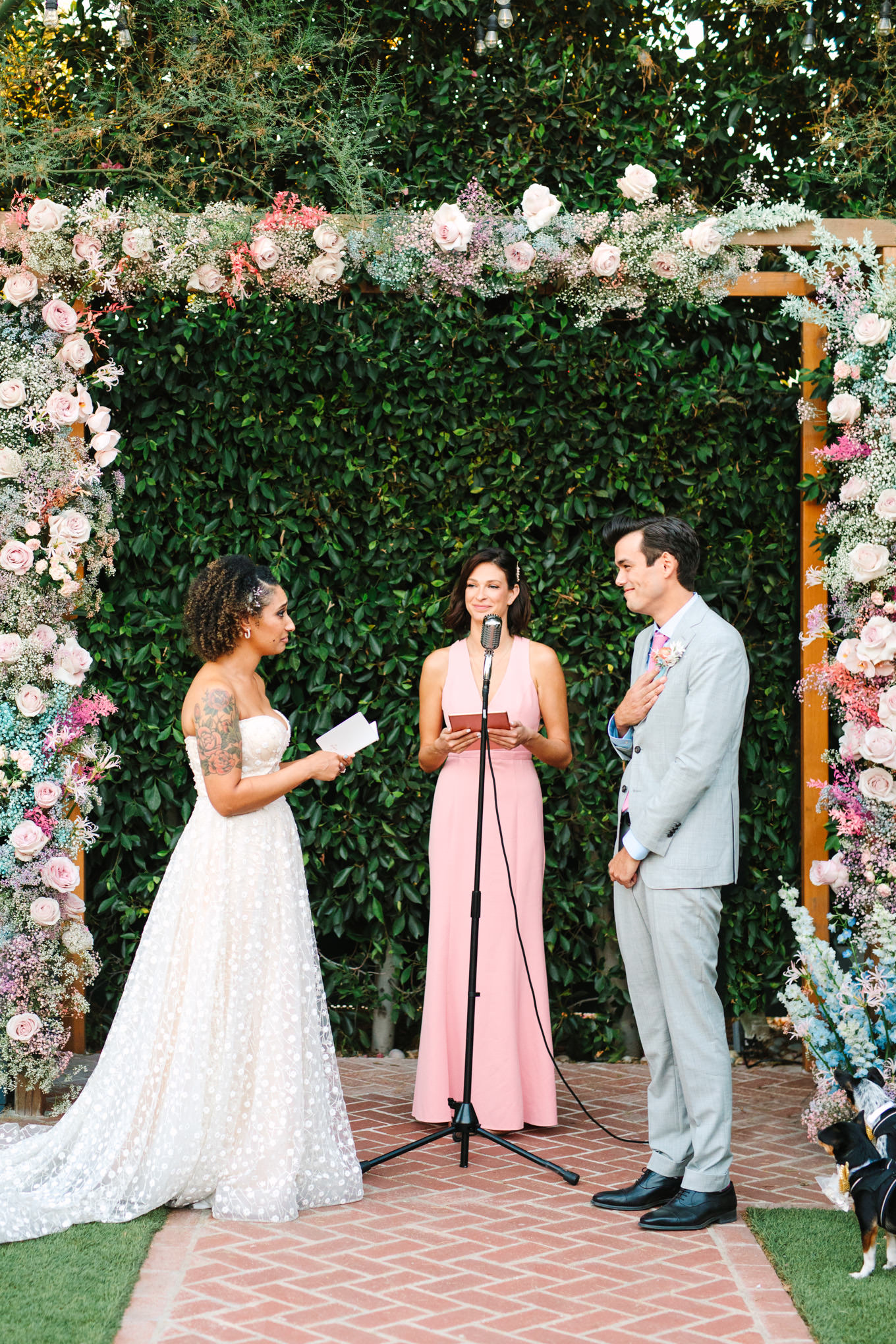 Bride and groom vow exchange | Colorful pop-up micro wedding at The Ruby Street Los Angeles featured on Green Wedding Shoes | Colorful and elevated photography for fun-loving couples in Southern California | #colorfulwedding #popupwedding #weddingphotography #microwedding Source: Mary Costa Photography | Los Angeles