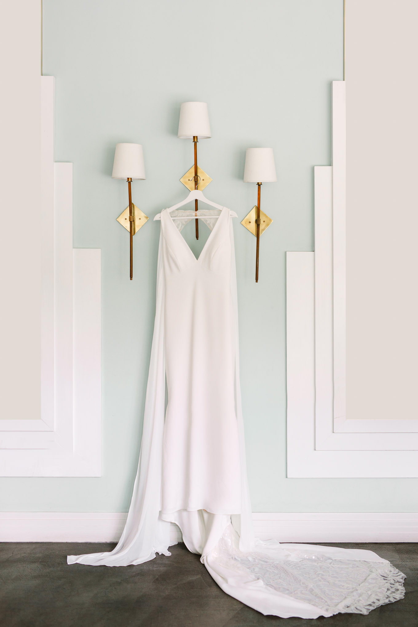 Bridal gown hanging on modern lamps | TV inspired wedding at The Fig House Los Angeles | Published on The Knot | Fresh and colorful photography for fun-loving couples in Southern California | #losangeleswedding #TVwedding #colorfulwedding #theknot   Source: Mary Costa Photography | Los Angeles wedding photographer