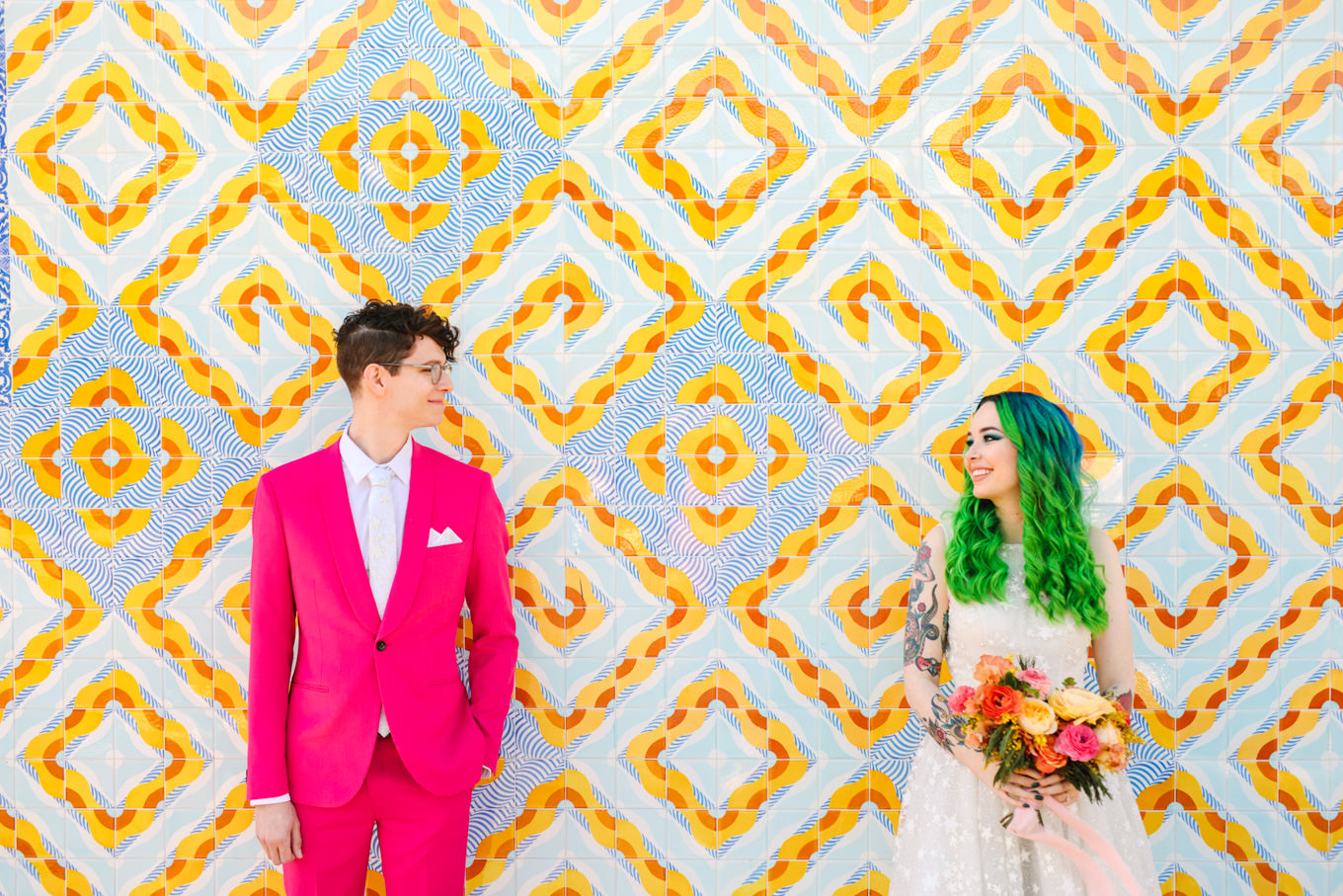 Bride with green hair and groom with hot pink suit | Colorful wedding at The Unique Space Los Angeles published in The Knot Magazine | Fresh and colorful photography for fun-loving couples in Southern California | #colorfulwedding #losangeleswedding #weddingphotography #uniquespace Source: Mary Costa Photography | Los Angeles