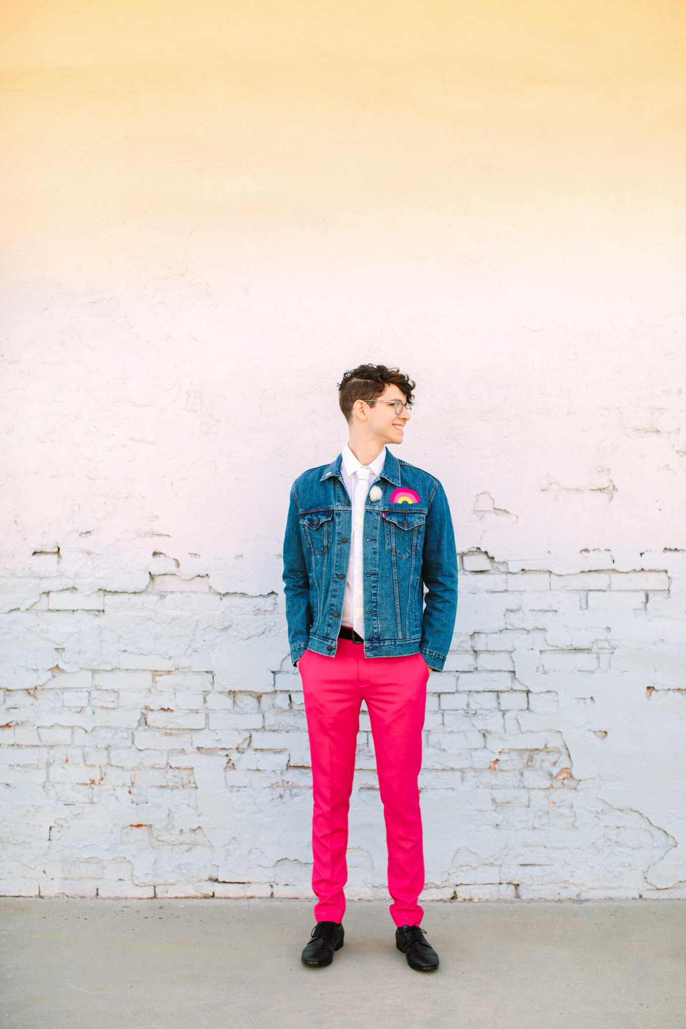 Groom in hot pink pants and denim jacket | Colorful wedding at The Unique Space Los Angeles published in The Knot Magazine | Fresh and colorful photography for fun-loving couples in Southern California | #colorfulwedding #losangeleswedding #weddingphotography #uniquespace Source: Mary Costa Photography | Los Angeles