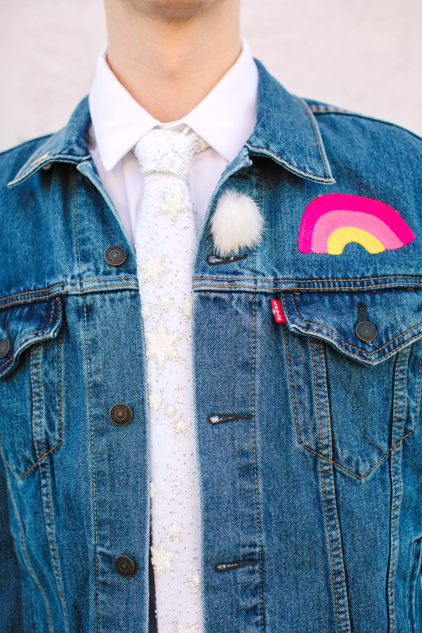 Custom denim jacket for groom | Colorful wedding at The Unique Space Los Angeles published in The Knot Magazine | Fresh and colorful photography for fun-loving couples in Southern California | #colorfulwedding #losangeleswedding #weddingphotography #uniquespace Source: Mary Costa Photography | Los Angeles