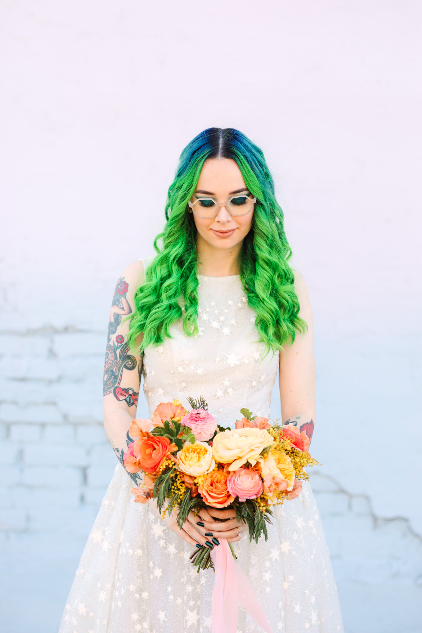 Bride with green ombre hair wearing cute glasses | Colorful wedding at The Unique Space Los Angeles published in The Knot Magazine | Fresh and colorful photography for fun-loving couples in Southern California | #colorfulwedding #losangeleswedding #weddingphotography #uniquespace Source: Mary Costa Photography | Los Angeles
