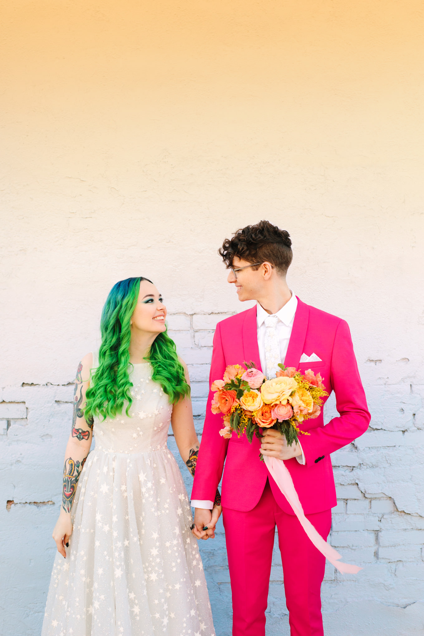 Bride with neon green hair and groom in hot pink suit | Colorful wedding at The Unique Space Los Angeles published in The Knot Magazine | Fresh and colorful photography for fun-loving couples in Southern California | #colorfulwedding #losangeleswedding #weddingphotography #uniquespace Source: Mary Costa Photography | Los Angeles
