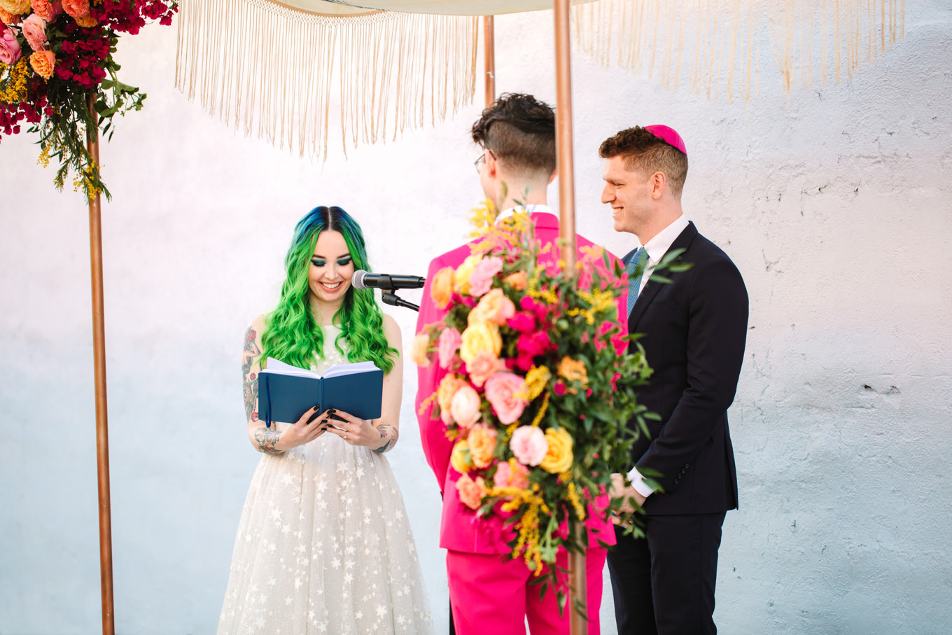 Bride with green hair reading wedding vows | Colorful wedding at The Unique Space Los Angeles published in The Knot Magazine | Fresh and colorful photography for fun-loving couples in Southern California | #colorfulwedding #losangeleswedding #weddingphotography #uniquespace Source: Mary Costa Photography | Los Angeles