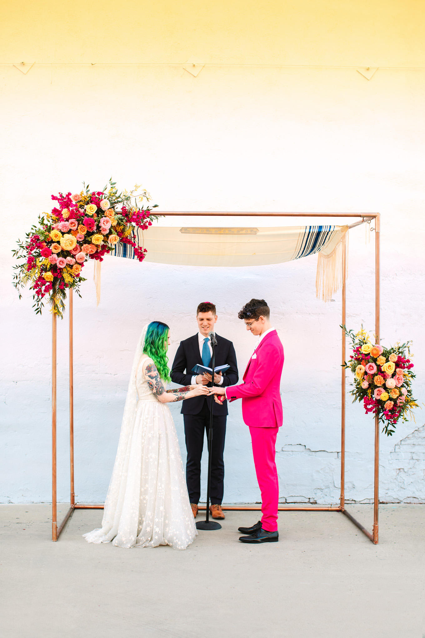 Ceremony ring exchange | Colorful wedding at The Unique Space Los Angeles published in The Knot Magazine | Fresh and colorful photography for fun-loving couples in Southern California | #colorfulwedding #losangeleswedding #weddingphotography #uniquespace Source: Mary Costa Photography | Los Angeles