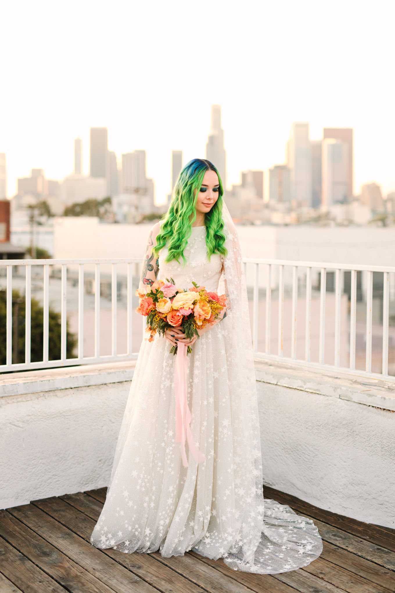 Portraits on rooftop with green hair bride in star glitter gown and star veil | Colorful wedding at The Unique Space Los Angeles published in The Knot Magazine | Fresh and colorful photography for fun-loving couples in Southern California | #colorfulwedding #losangeleswedding #weddingphotography #uniquespace Source: Mary Costa Photography | Los Angeles