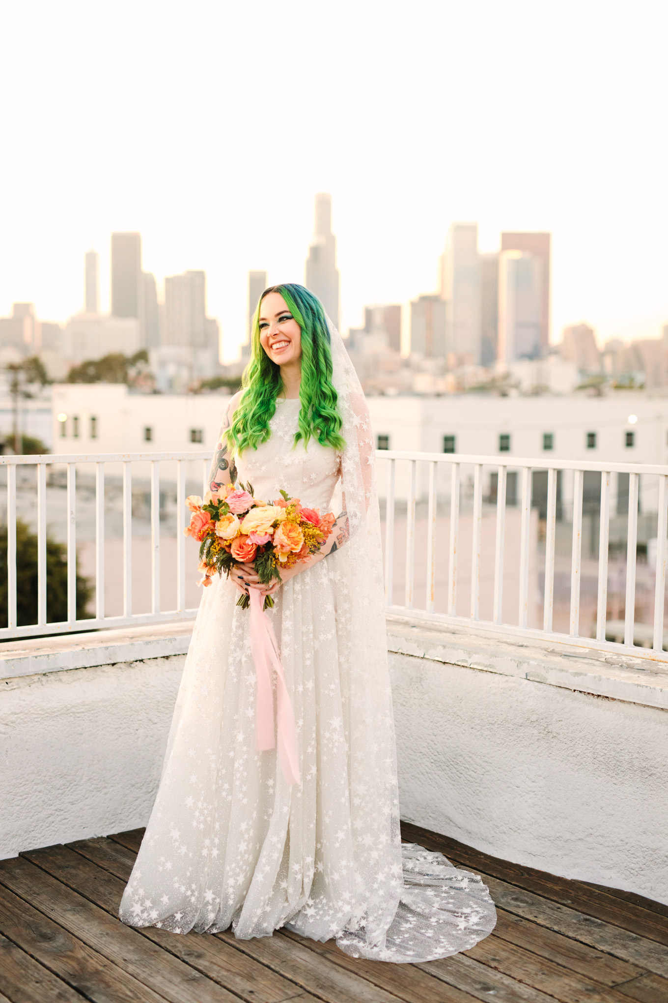 Portraits on rooftop with green hair bride in star gown | Colorful wedding at The Unique Space Los Angeles published in The Knot Magazine | Fresh and colorful photography for fun-loving couples in Southern California | #colorfulwedding #losangeleswedding #weddingphotography #uniquespace Source: Mary Costa Photography | Los Angeles