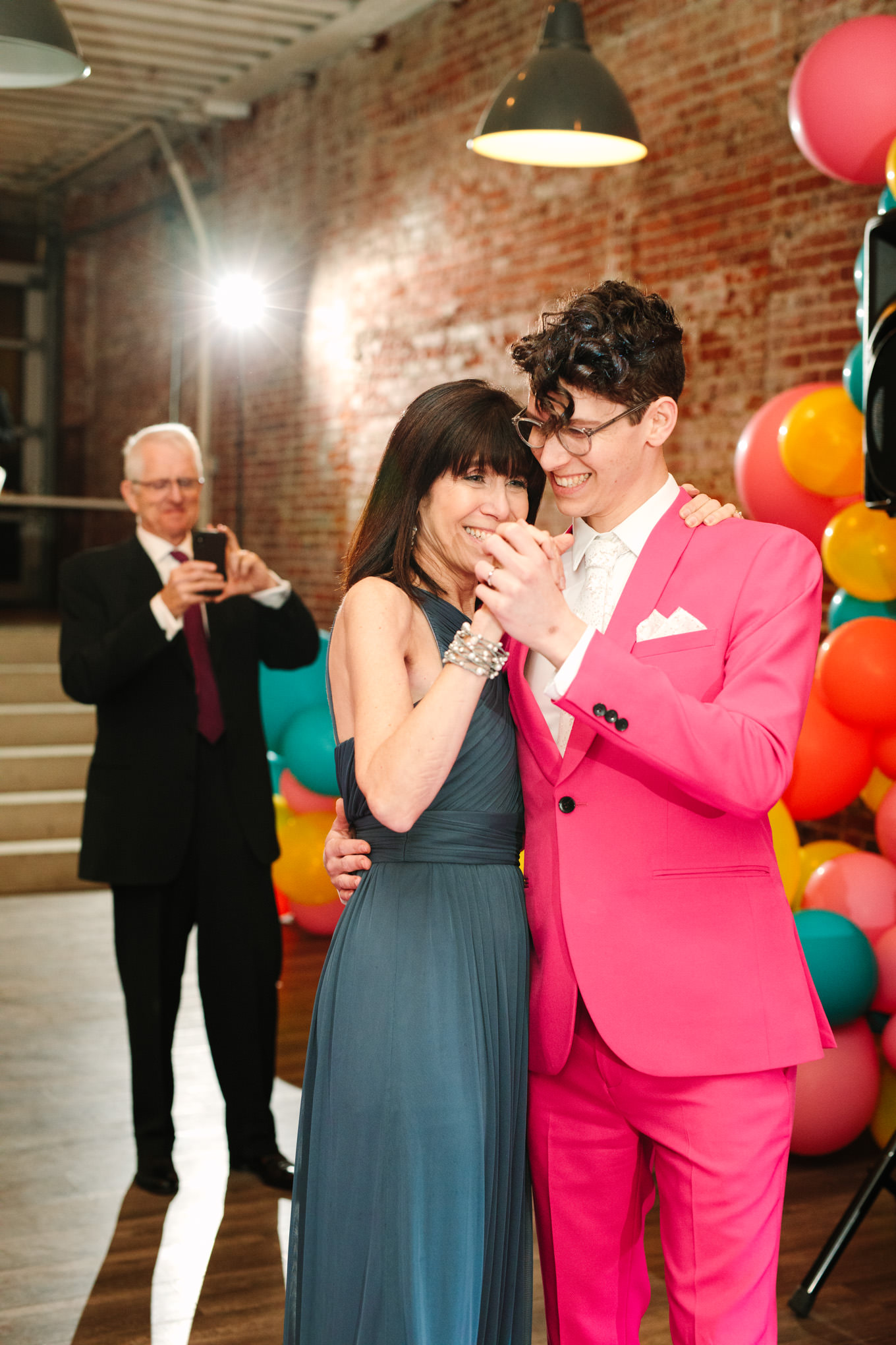 Groom dancing with mom | Colorful wedding at The Unique Space Los Angeles published in The Knot Magazine | Fresh and colorful photography for fun-loving couples in Southern California | #colorfulwedding #losangeleswedding #weddingphotography #uniquespace Source: Mary Costa Photography | Los Angeles