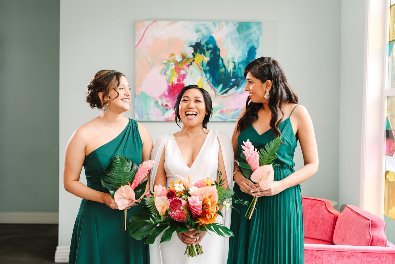 Bride laughing with bridesmaids in green dresses | TV inspired wedding at The Fig House Los Angeles | Published on The Knot | Fresh and colorful photography for fun-loving couples in Southern California | #losangeleswedding #TVwedding #colorfulwedding #theknot   Source: Mary Costa Photography | Los Angeles wedding photographer