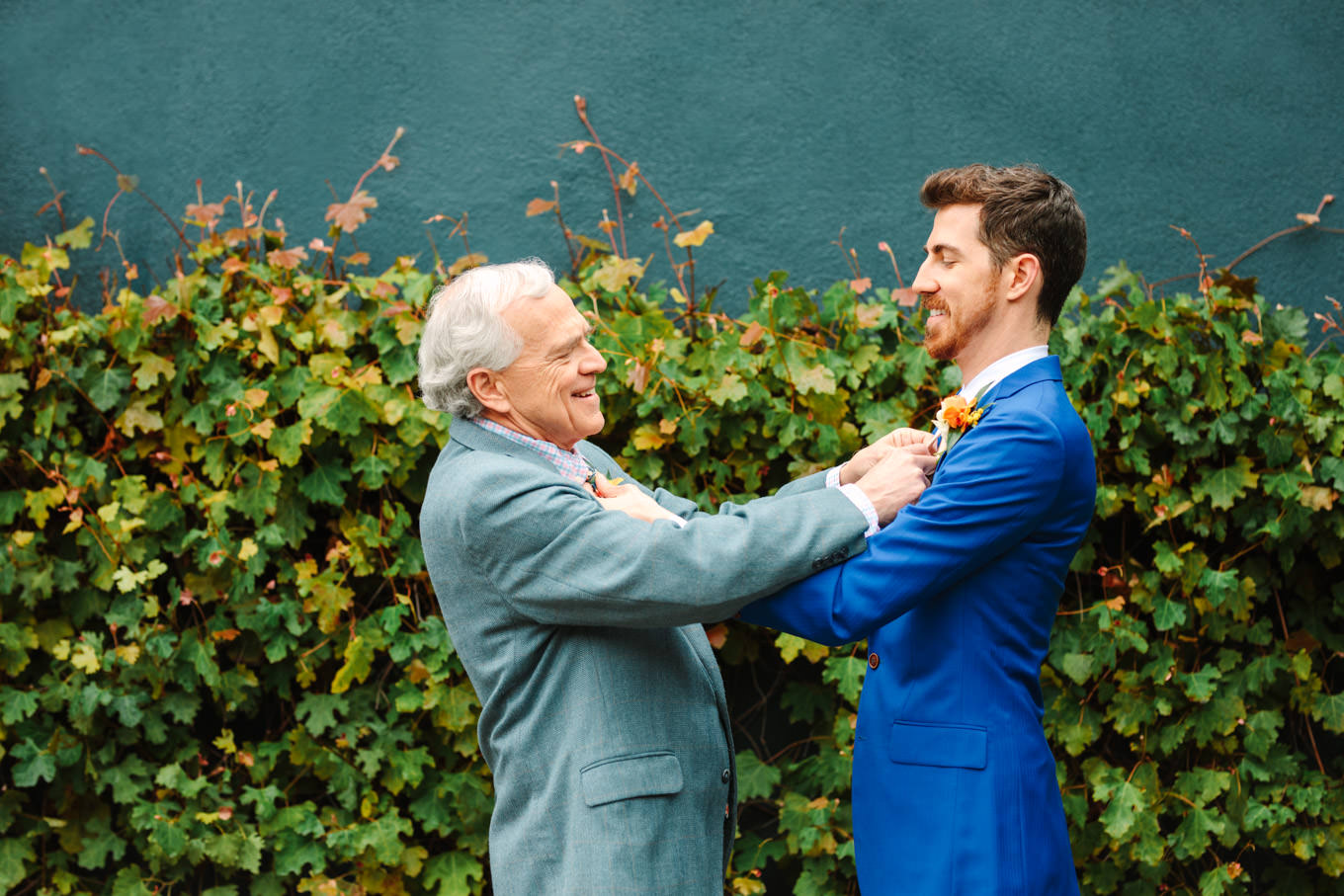 Groom and dad adjusting ties | TV inspired wedding at The Fig House Los Angeles | Published on The Knot | Fresh and colorful photography for fun-loving couples in Southern California | #losangeleswedding #TVwedding #colorfulwedding #theknot   Source: Mary Costa Photography | Los Angeles wedding photographer