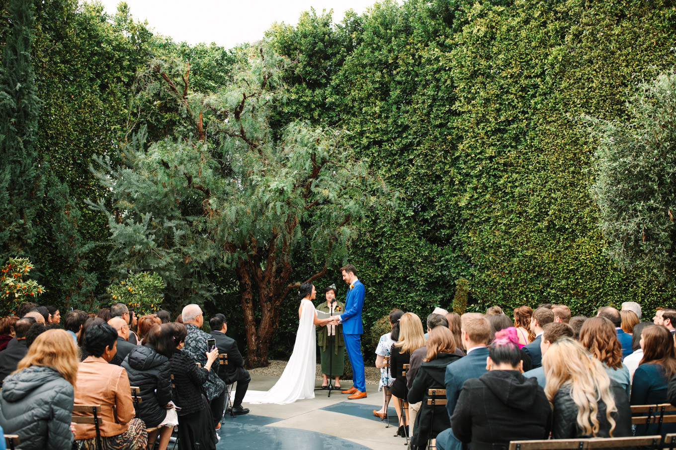 Wedding ceremony with officiant dressed as Joey from Friends | TV inspired wedding at The Fig House Los Angeles | Published on The Knot | Fresh and colorful photography for fun-loving couples in Southern California | #losangeleswedding #TVwedding #colorfulwedding #theknot   Source: Mary Costa Photography | Los Angeles wedding photographer