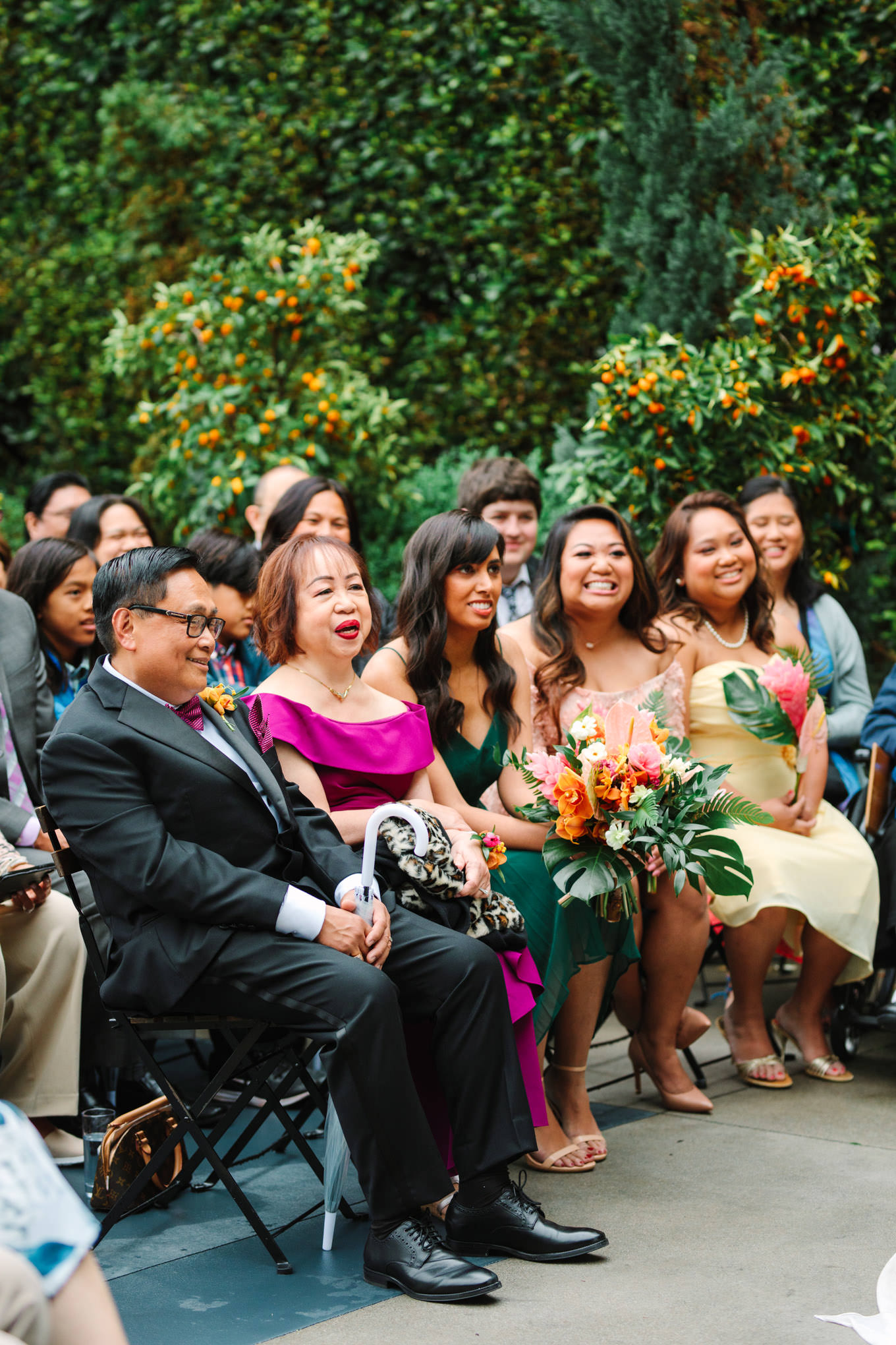 Wedding guests watching ceremony | TV inspired wedding at The Fig House Los Angeles | Published on The Knot | Fresh and colorful photography for fun-loving couples in Southern California | #losangeleswedding #TVwedding #colorfulwedding #theknot   Source: Mary Costa Photography | Los Angeles wedding photographer