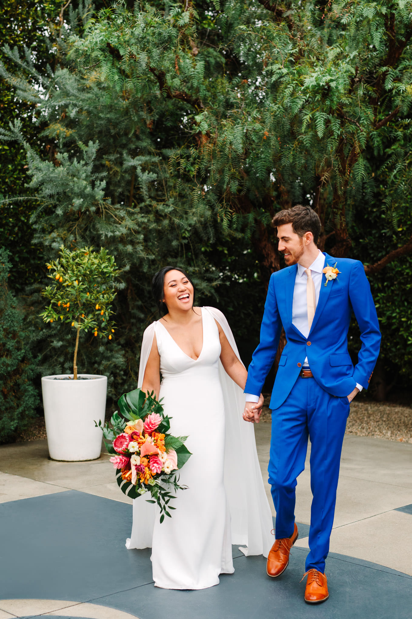 Bride and groom walking together | TV inspired wedding at The Fig House Los Angeles | Published on The Knot | Fresh and colorful photography for fun-loving couples in Southern California | #losangeleswedding #TVwedding #colorfulwedding #theknot   Source: Mary Costa Photography | Los Angeles wedding photographer
