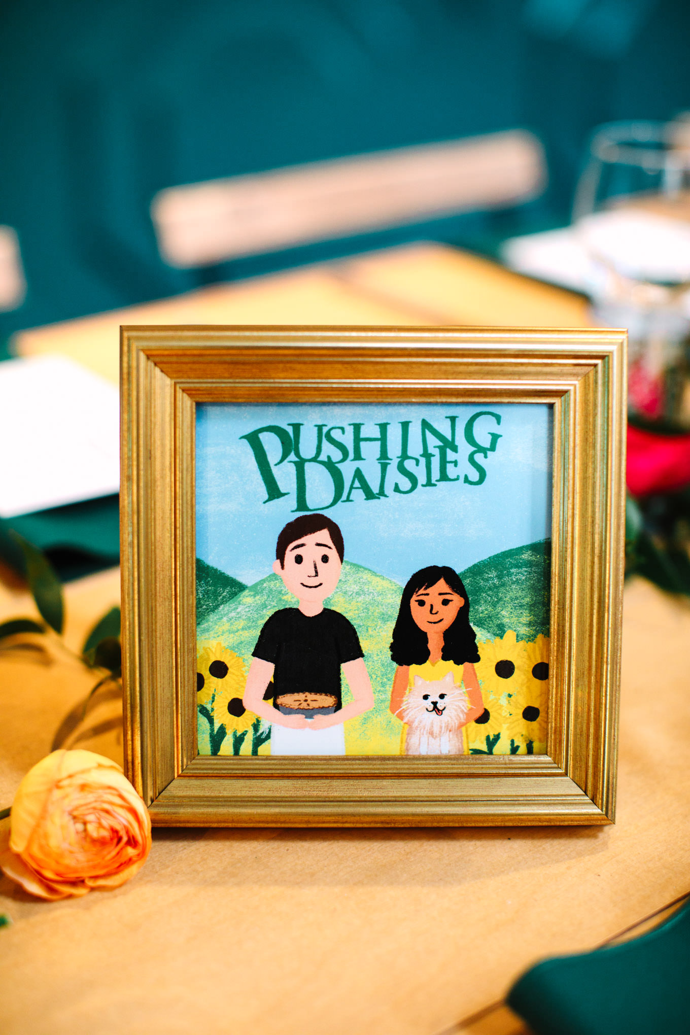 Pushing Daisies table illustration featuring the bride and groom | TV inspired wedding at The Fig House Los Angeles | Published on The Knot | Fresh and colorful photography for fun-loving couples in Southern California | #losangeleswedding #TVwedding #colorfulwedding #theknot   Source: Mary Costa Photography | Los Angeles wedding photographer