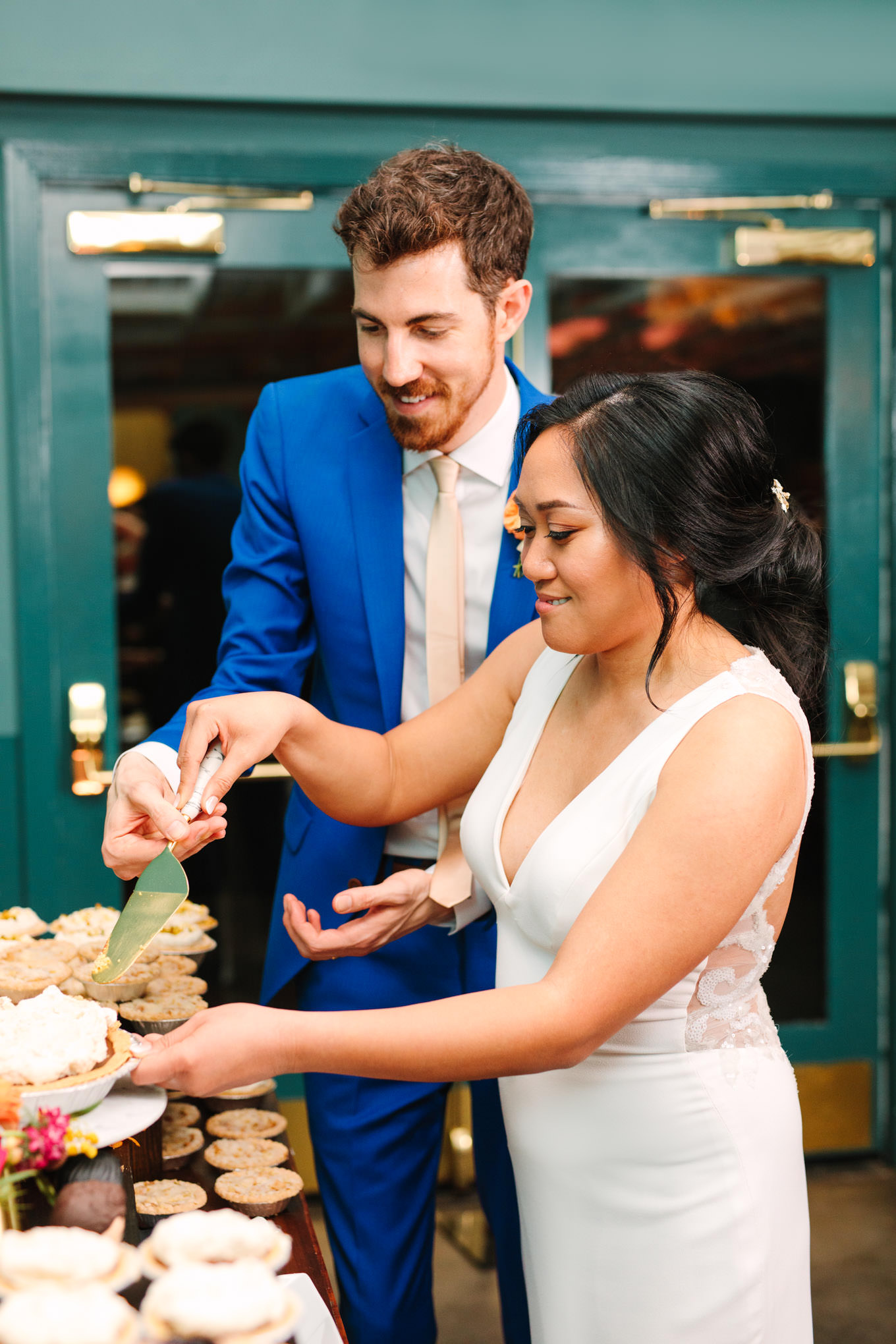 Bride and groom cutting pie together | TV inspired wedding at The Fig House Los Angeles | Published on The Knot | Fresh and colorful photography for fun-loving couples in Southern California | #losangeleswedding #TVwedding #colorfulwedding #theknot   Source: Mary Costa Photography | Los Angeles wedding photographer